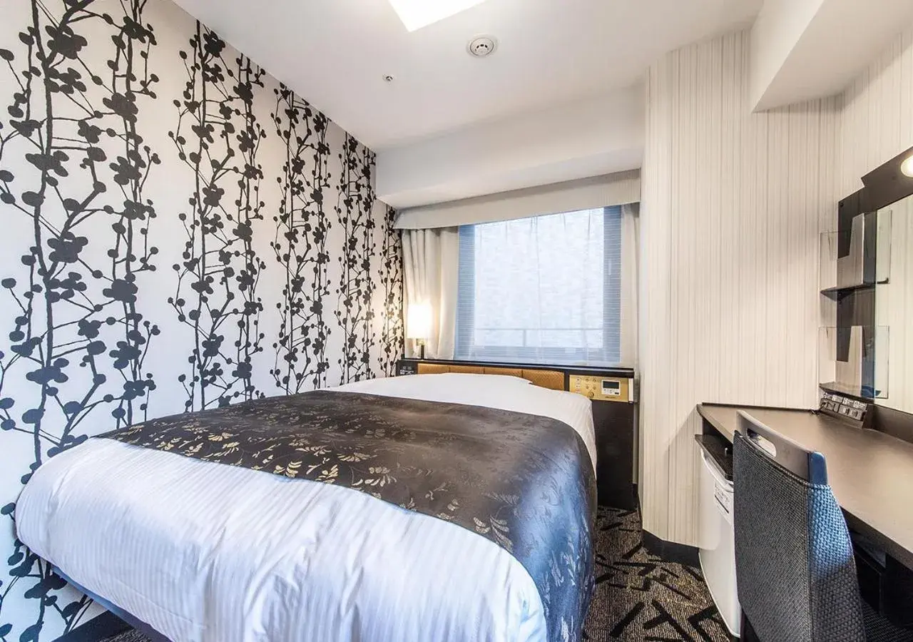 Bed in APA Hotel Kobe Sannomiya Ekimae Bed in APA Hotel Kobe Sannomiya Ekimae