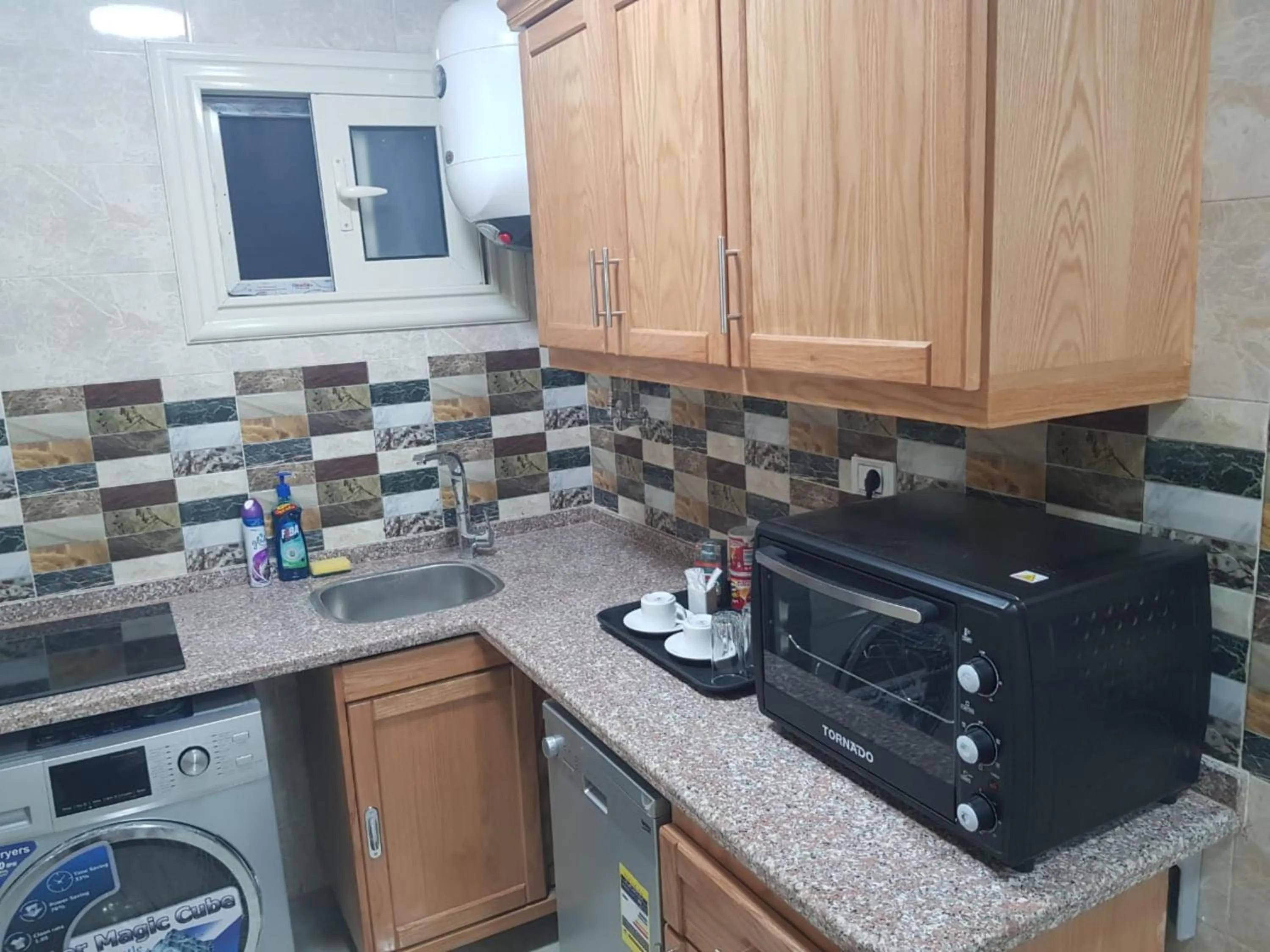 Kitchen or kitchenette in Al Raya Apartments