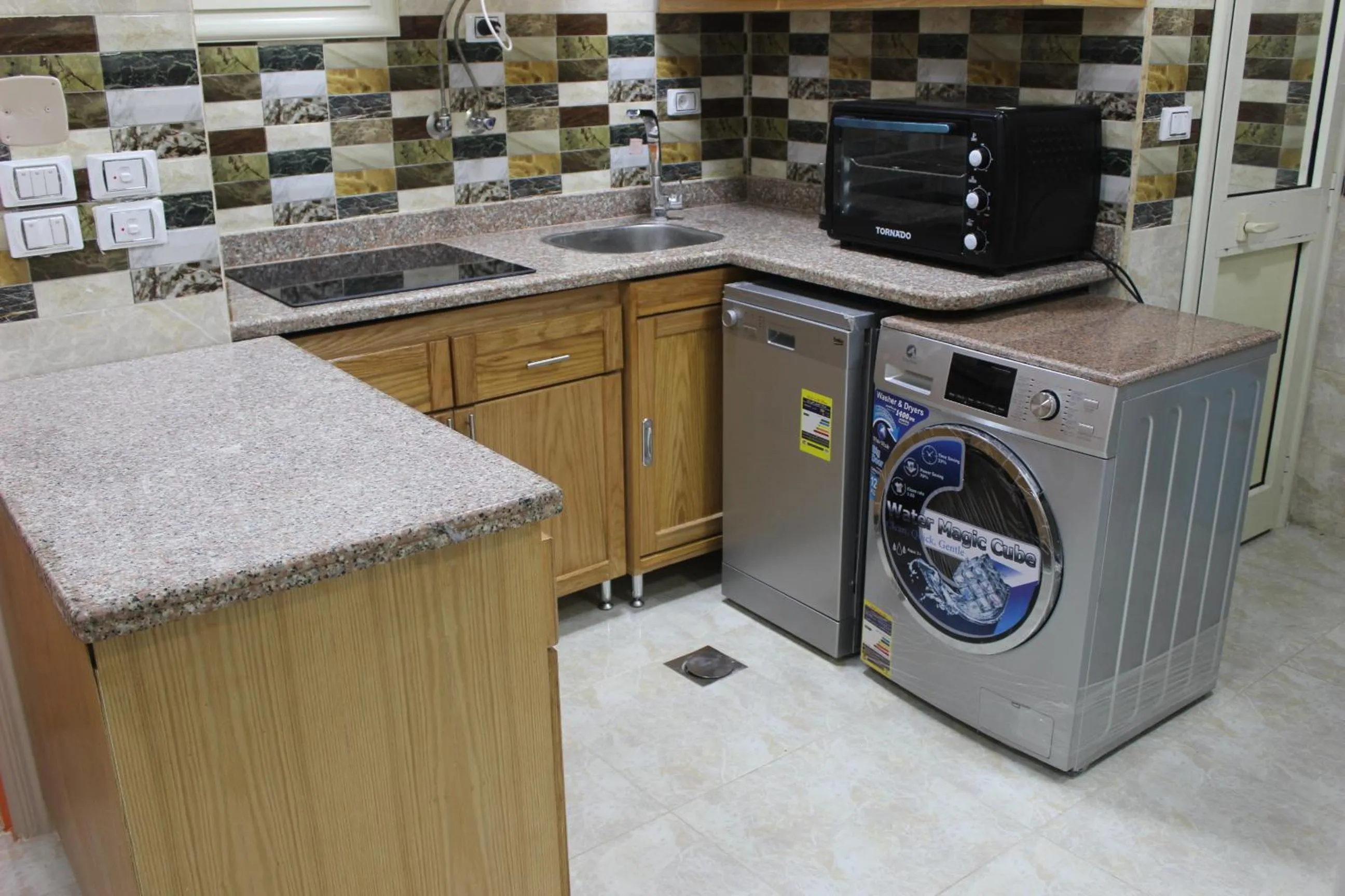 Kitchen or kitchenette in Al Raya Apartments