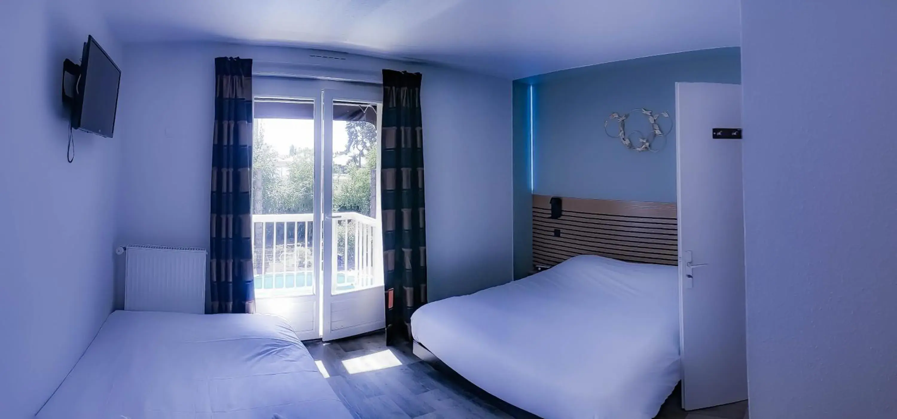 Photo of the whole room, Bed in Logis Les Charmilles Chalon-sur-Saône Sud Photo of the whole room, Bed in Logis Les Charmilles Chalon-sur-Saône Sud