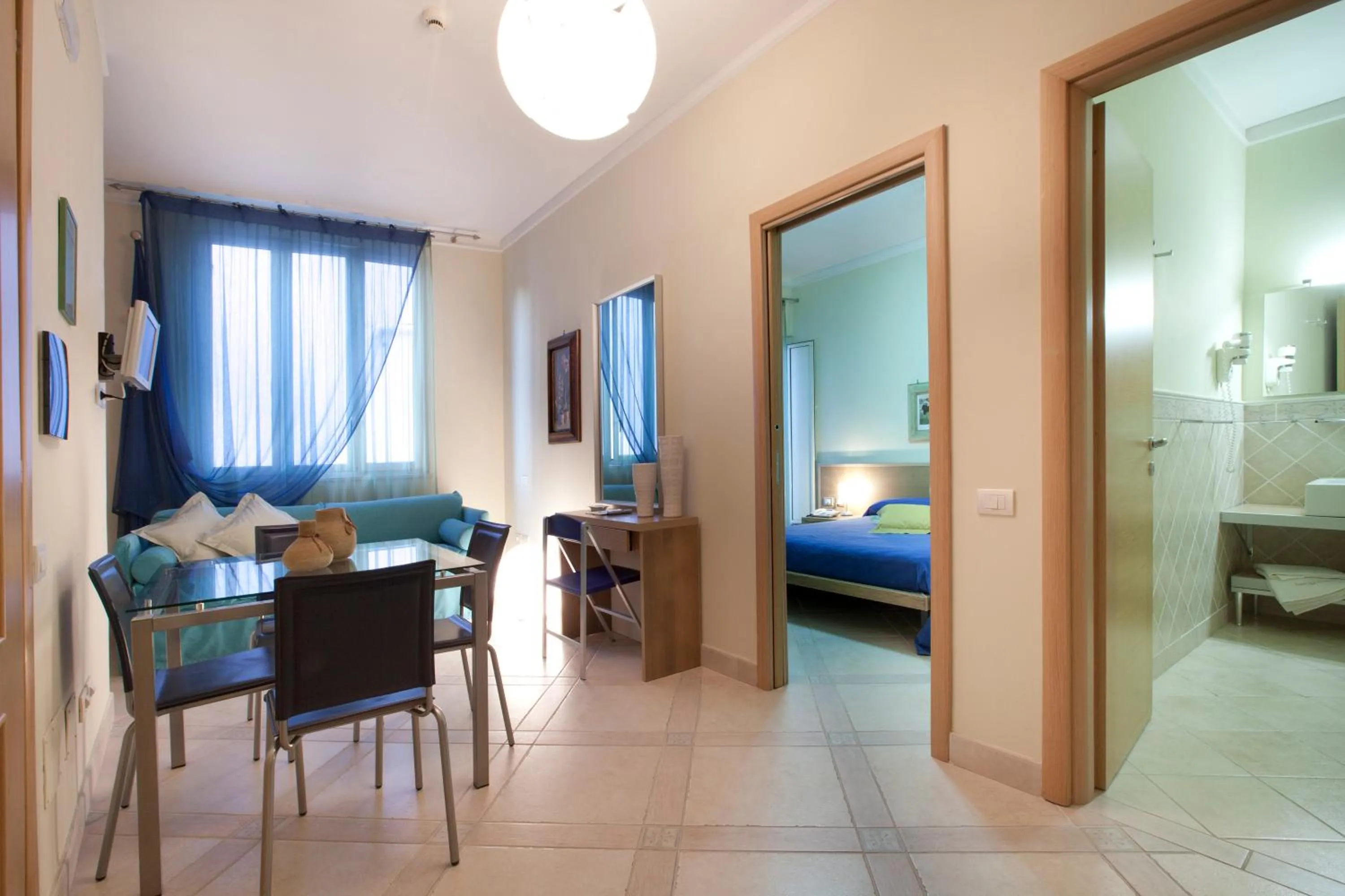 Living room, Bed in Posidonia Residence