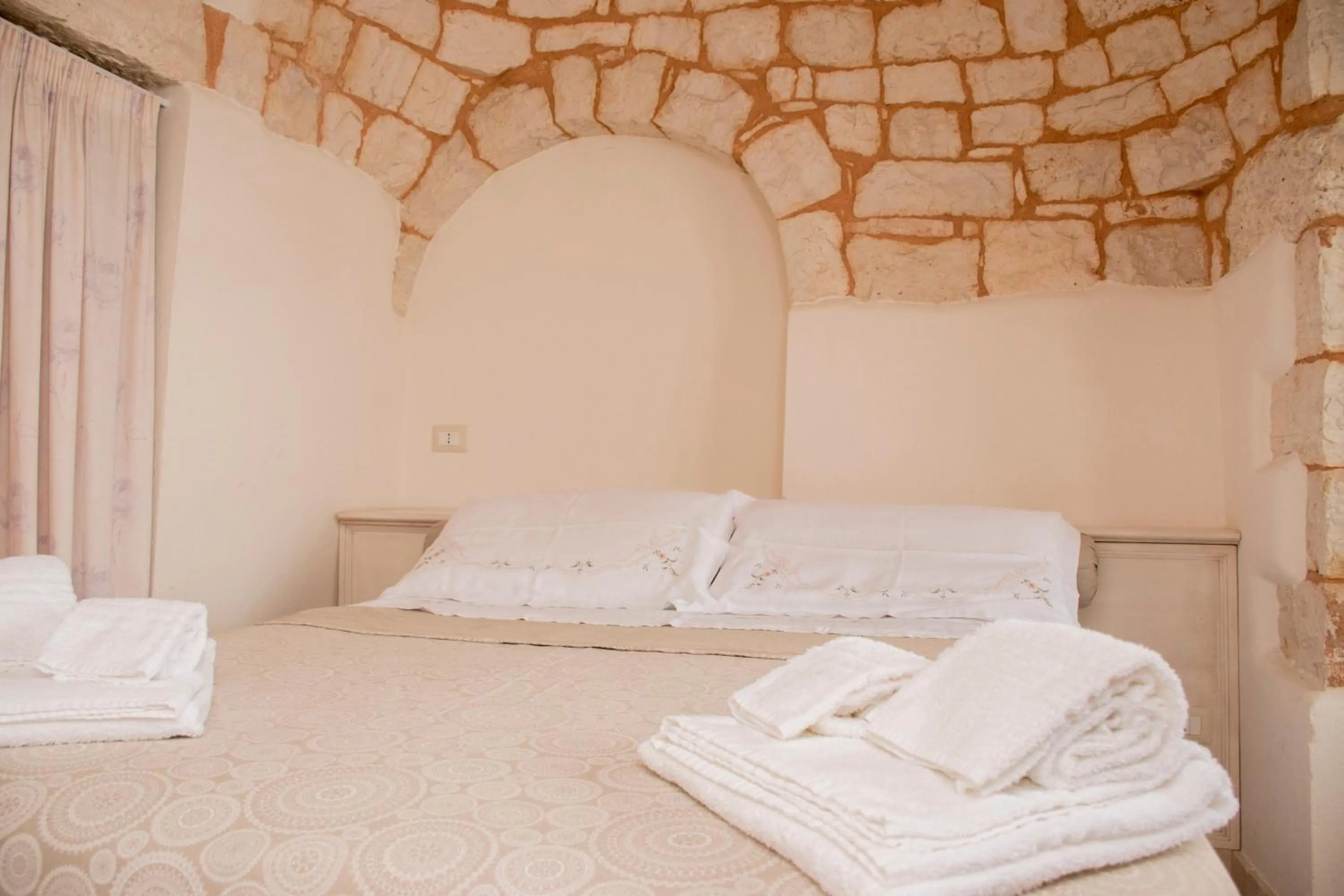 Bed in Micele Holiday Houses