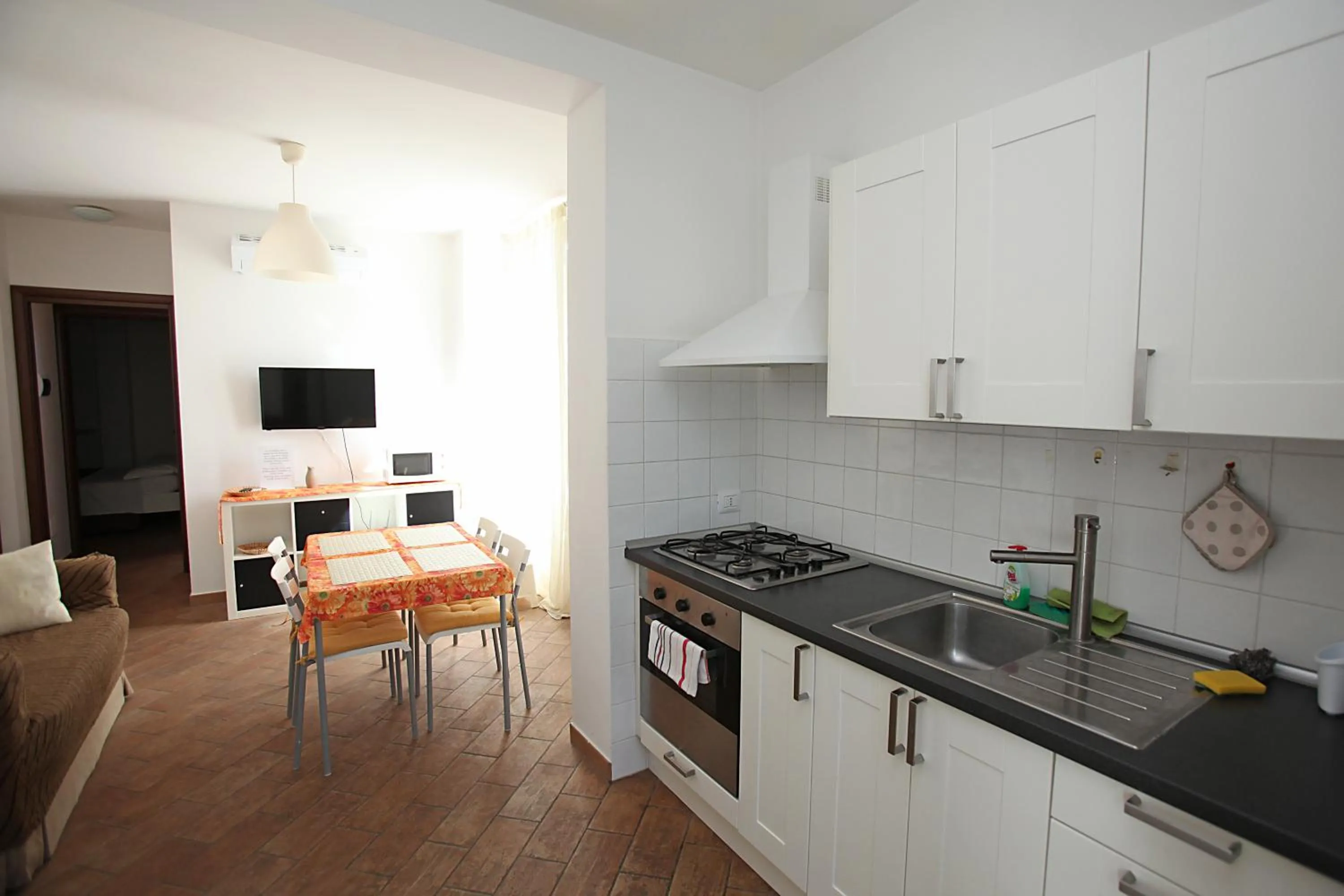 Kitchen or kitchenette in Orchidea Rooms & Suites