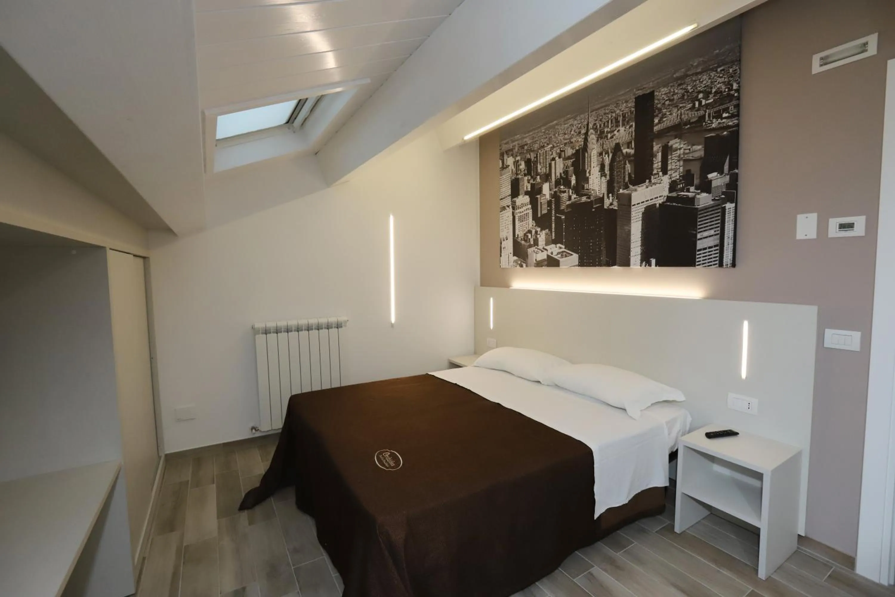 Bed in Orchidea Rooms & Suites