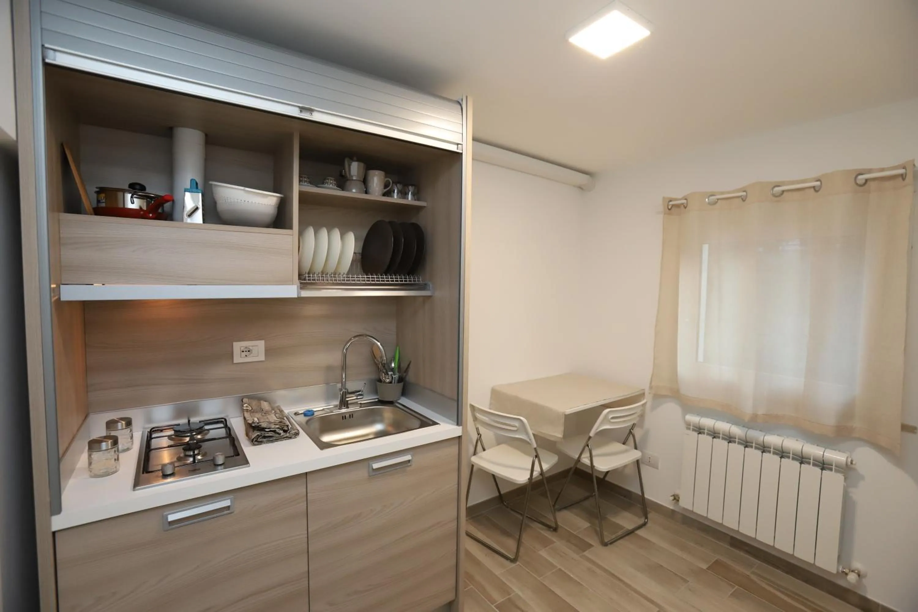 Kitchen or kitchenette in Orchidea Rooms & Suites