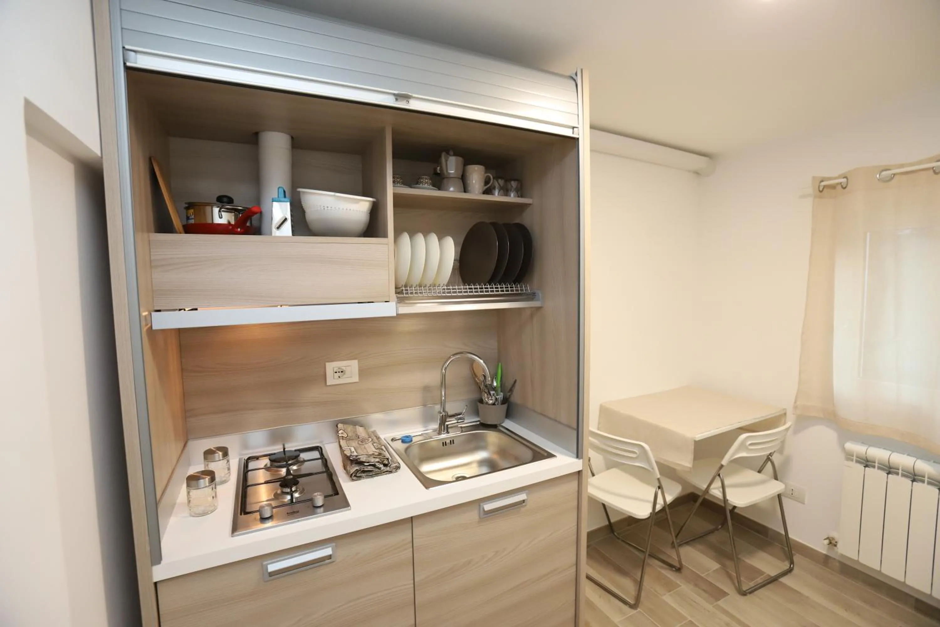 Kitchen or kitchenette in Orchidea Rooms & Suites