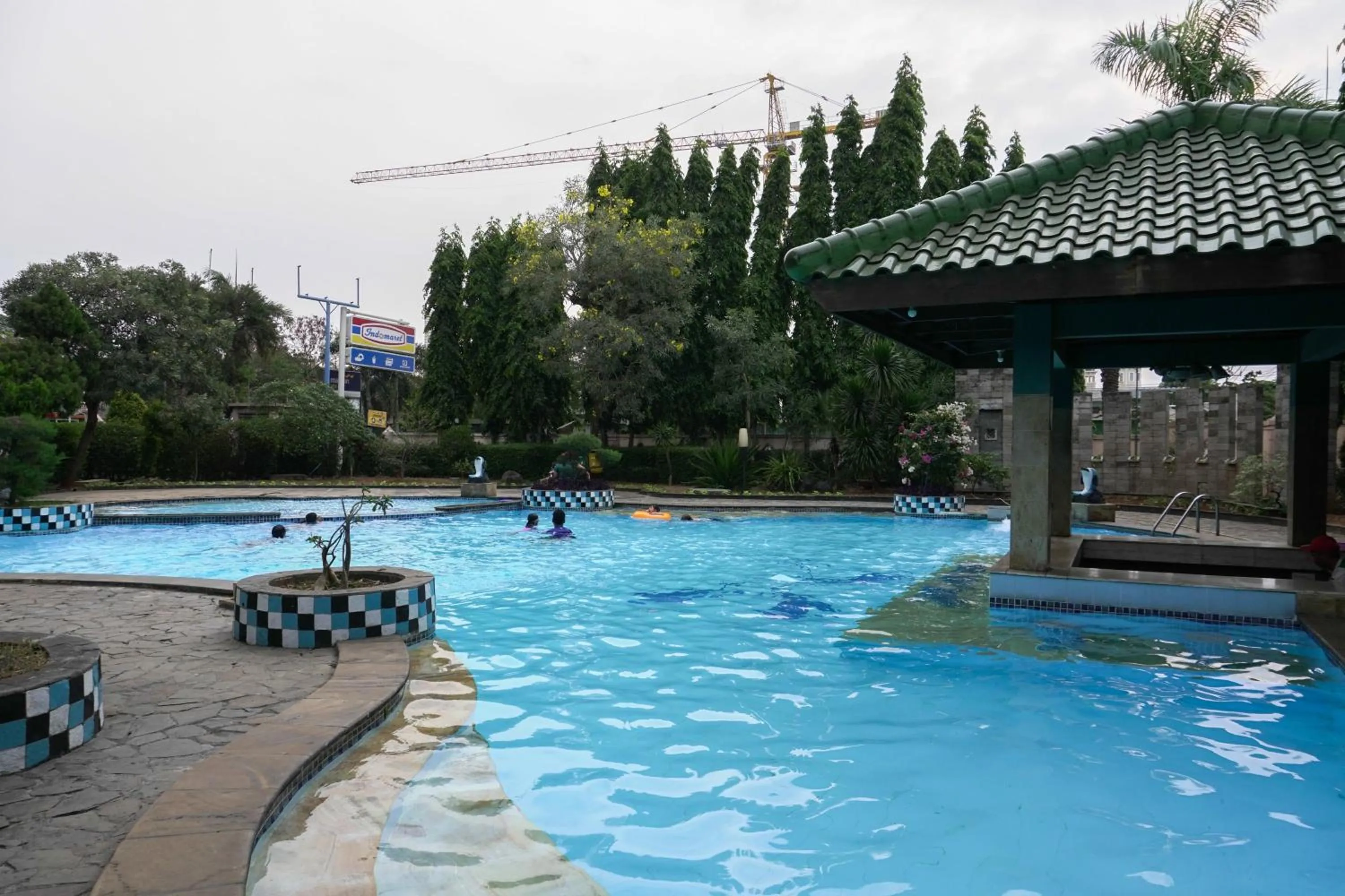 Swimming pool in Big and Cozy Studio Apartment at Puri Garden By Travelio