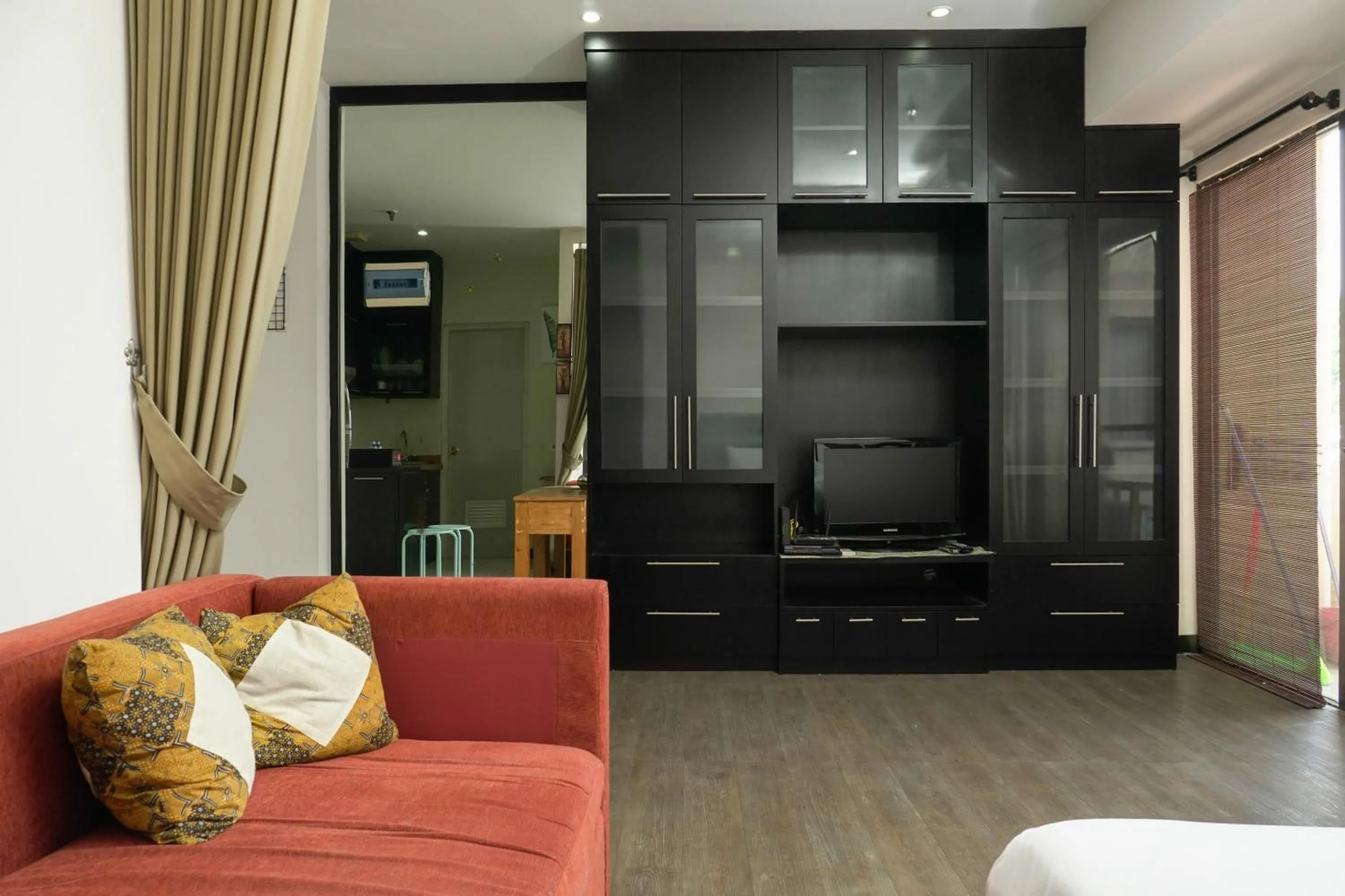 Living room, Bed in Big and Cozy Studio Apartment at Puri Garden By Travelio