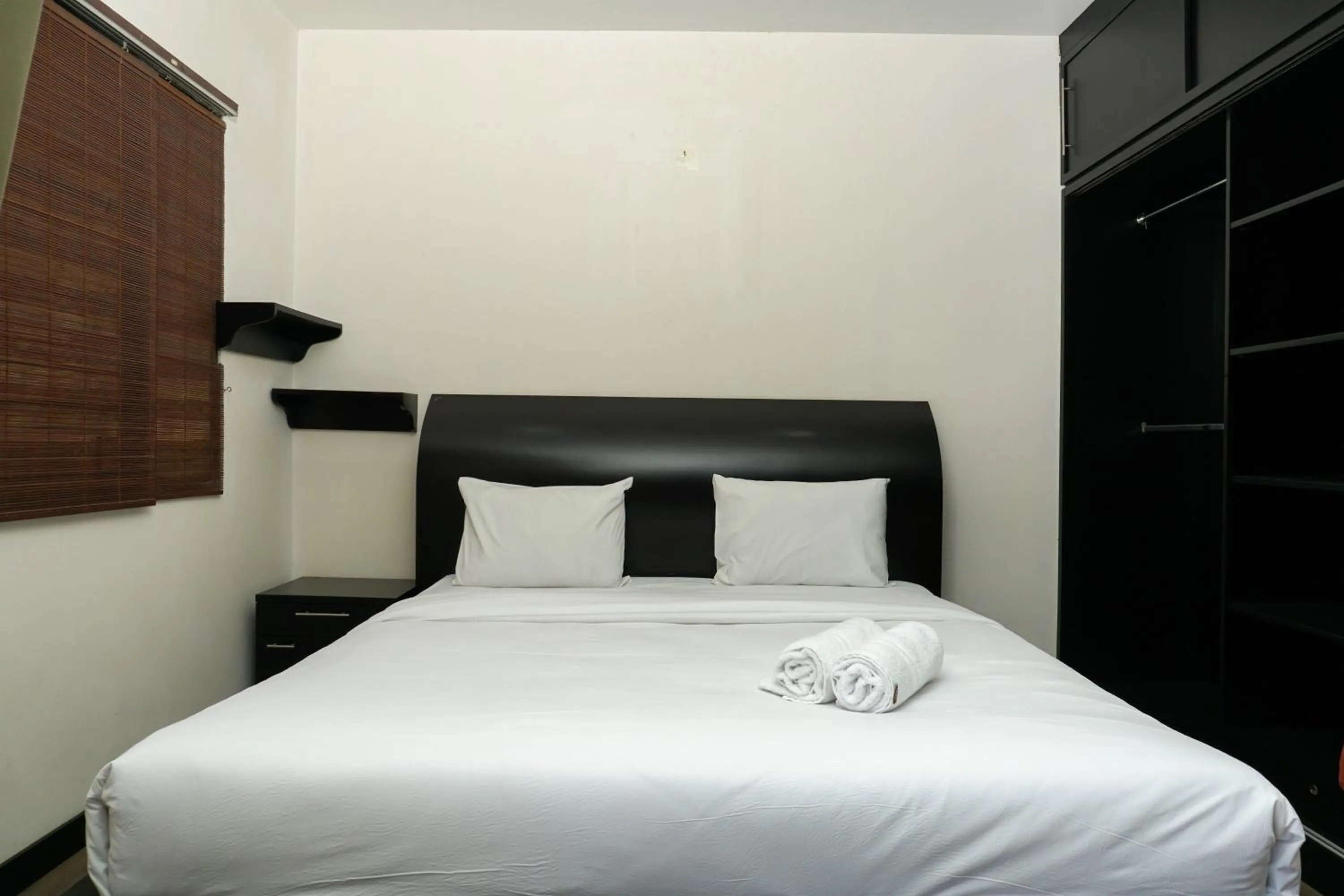 Bed in Big and Cozy Studio Apartment at Puri Garden By Travelio