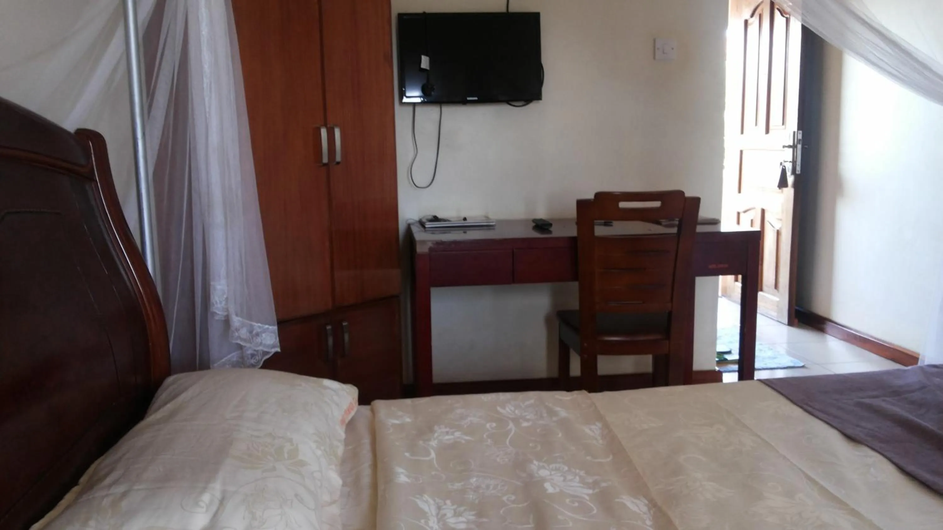 Bedroom in Zawadi Hotel