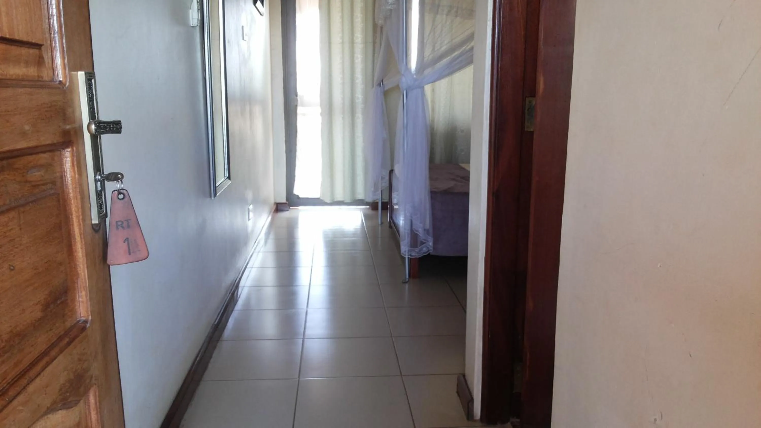 Bedroom in Zawadi Hotel