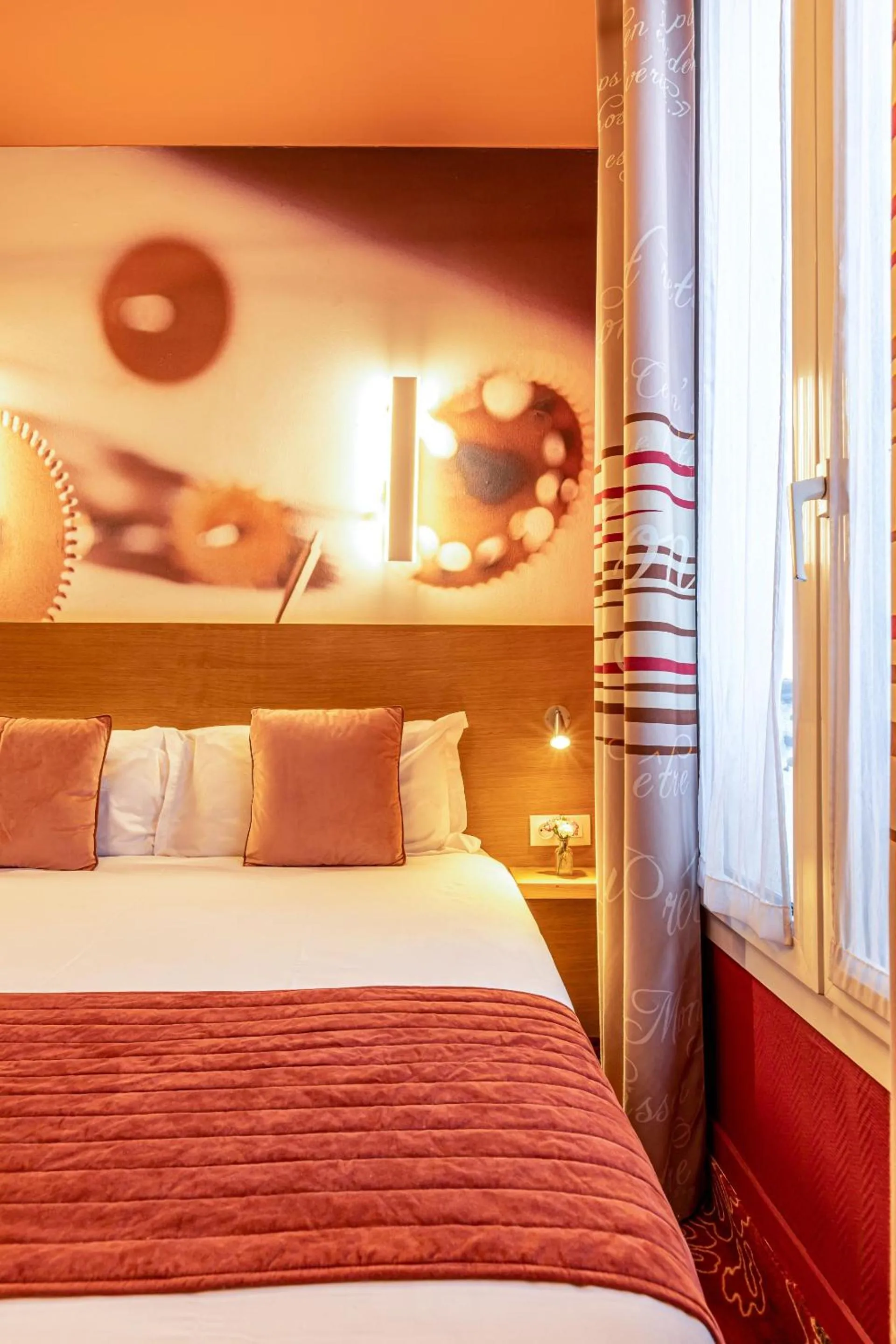 Bed in Hotel Ariane Montparnasse by Patrick Hayat