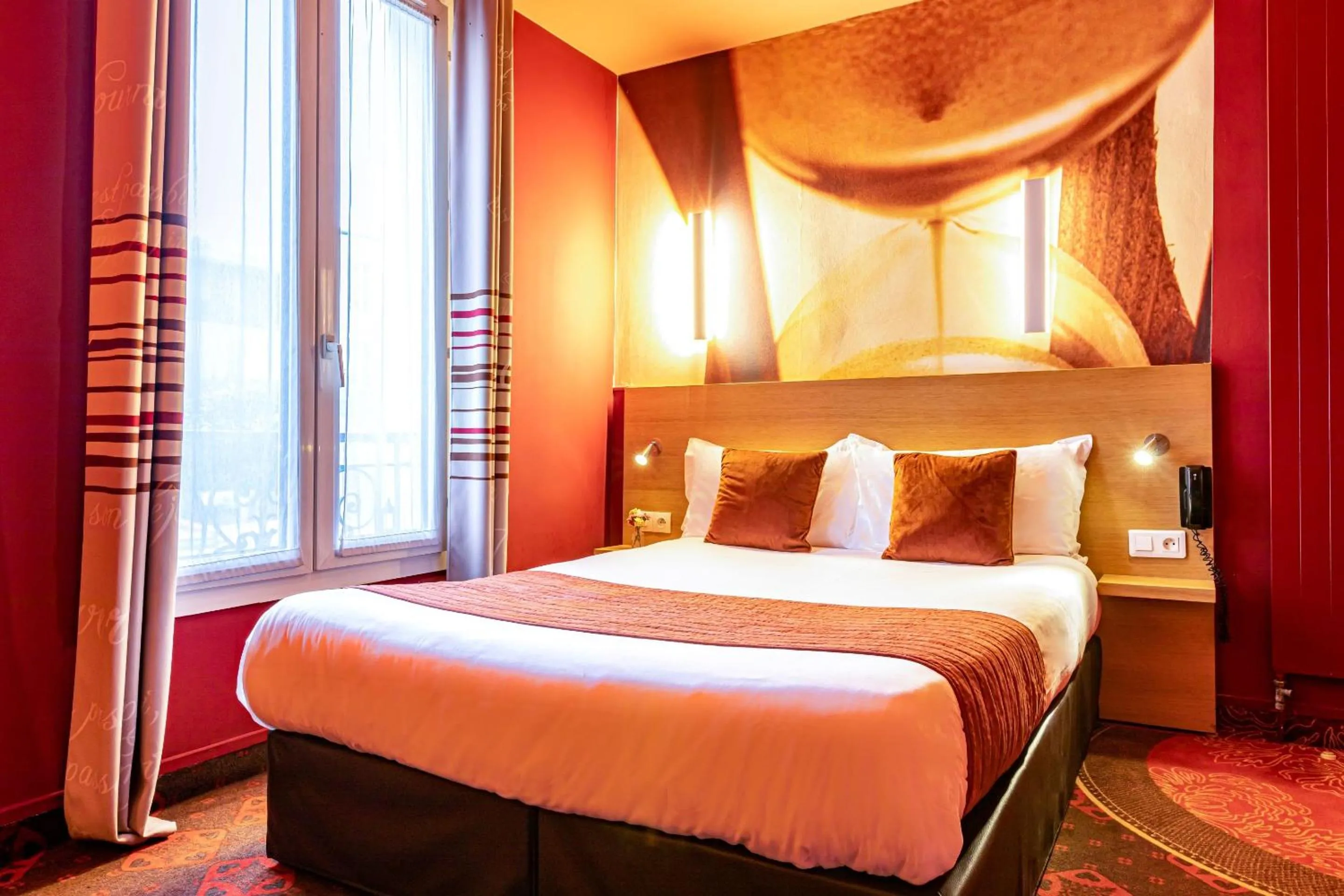 Bed in Hotel Ariane Montparnasse by Patrick Hayat