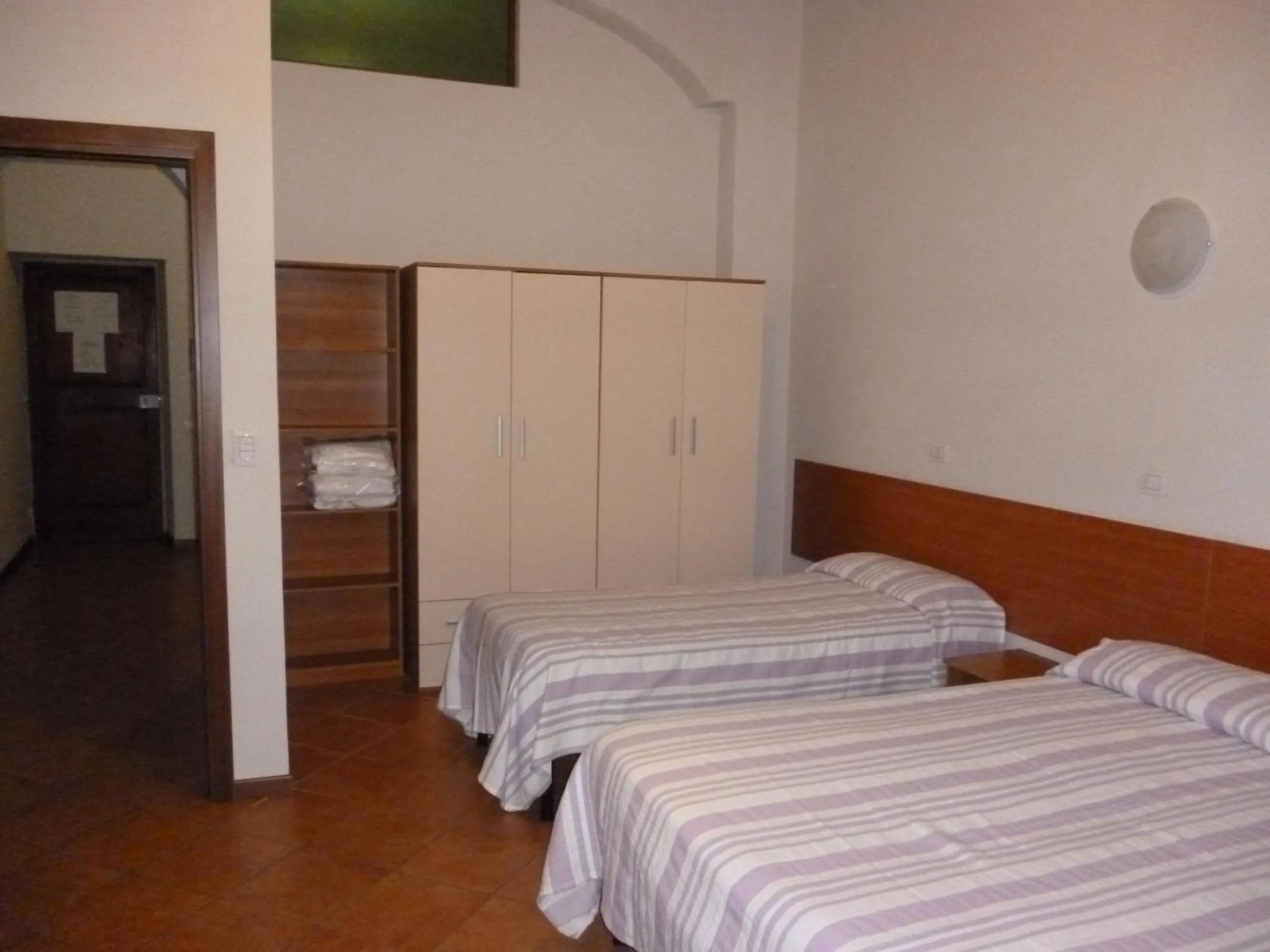 Photo of the whole room, Bed in 27 Aprile