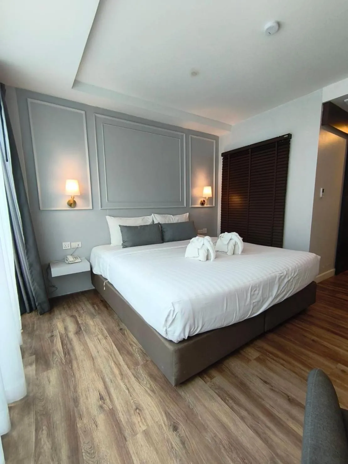 Bed in The Wing Boutique Hotel