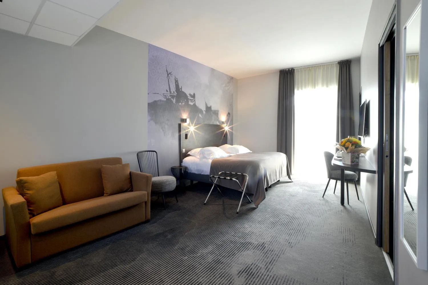 Photo of the whole room, Bed in Logis Hôtel Victor Hugo & Spa