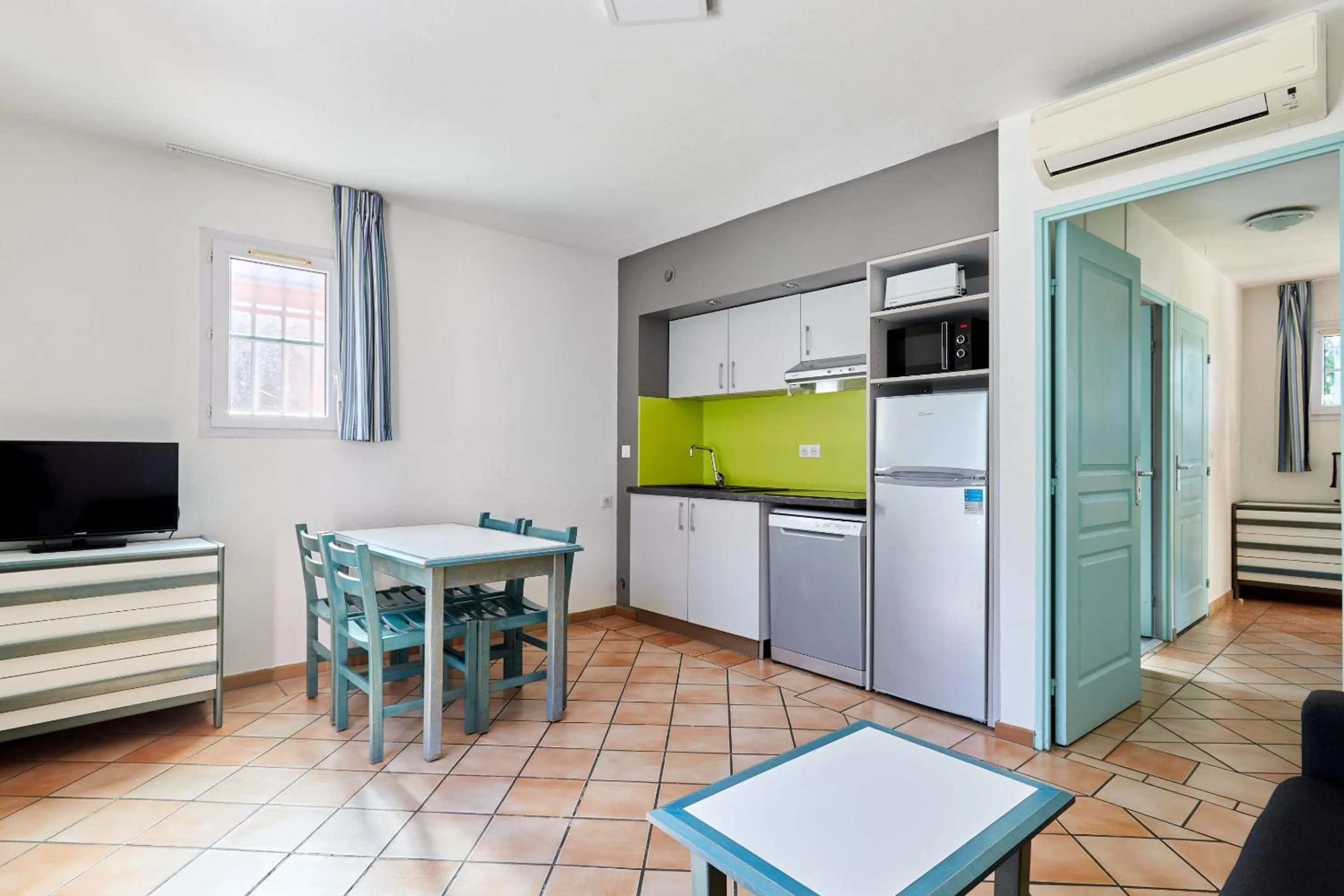 Kitchen or kitchenette in Résidence Odalys La Palmeraie