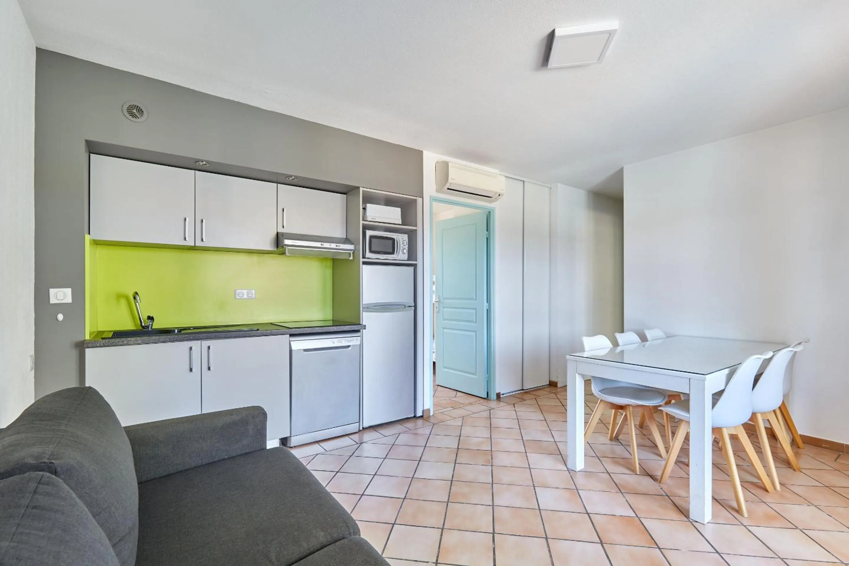 Kitchen or kitchenette in Résidence Odalys La Palmeraie