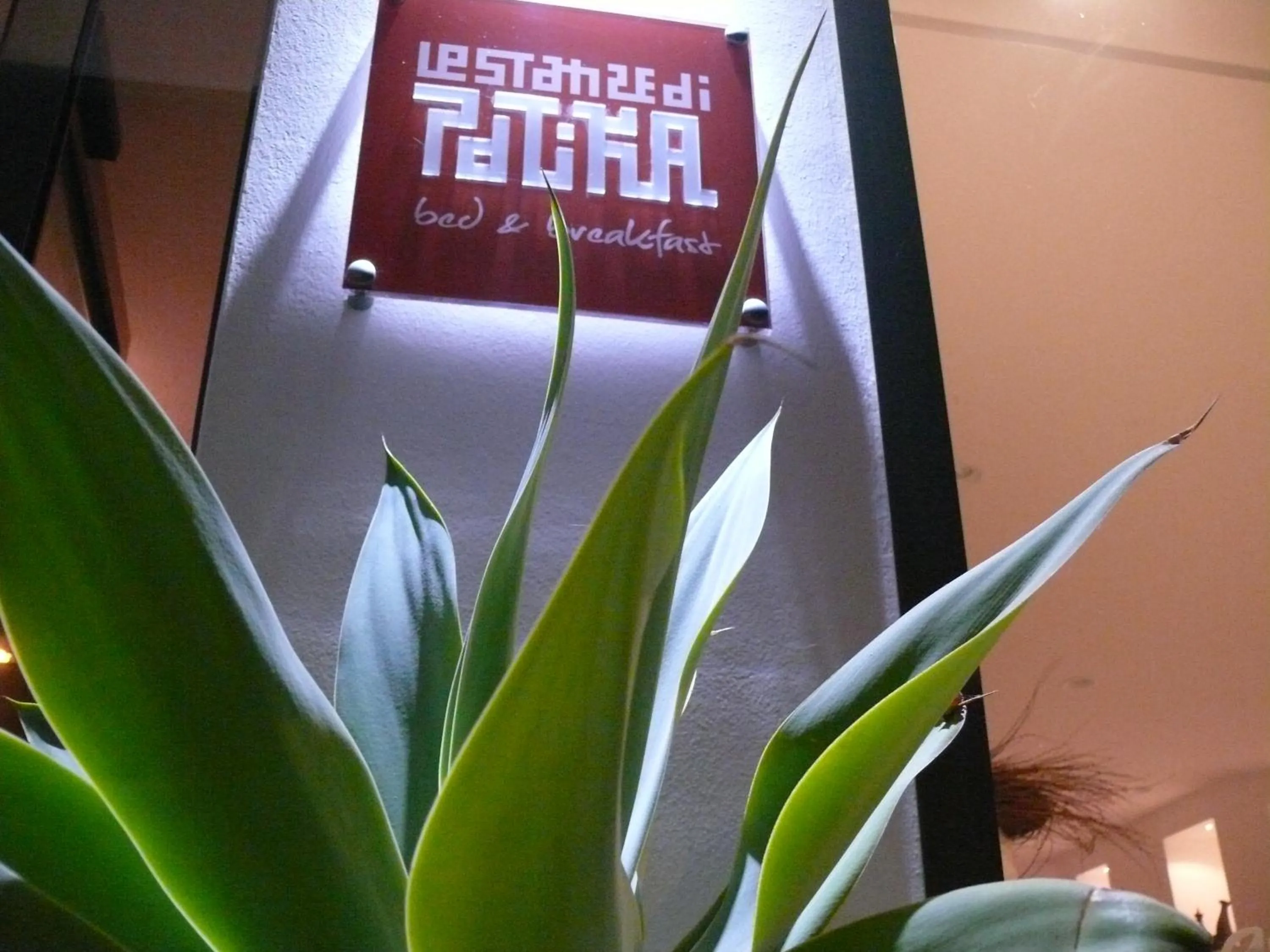 Property logo or sign in Le Stanze di Patika