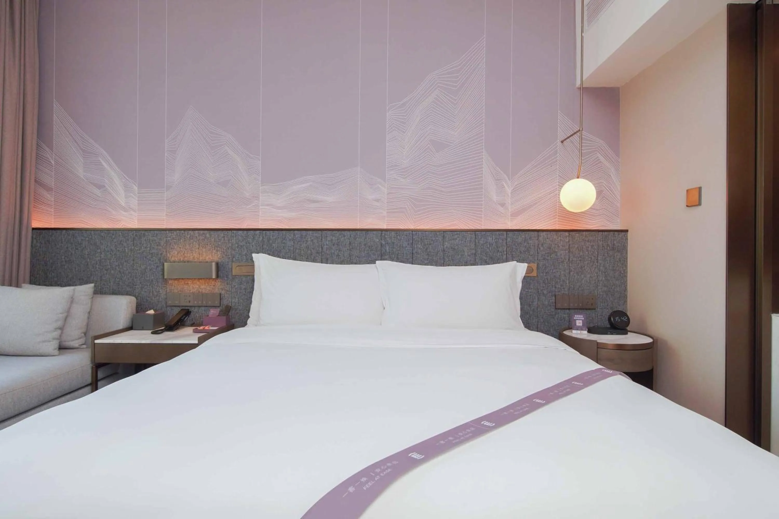 Bed in Imperial Traders Elong Hotel