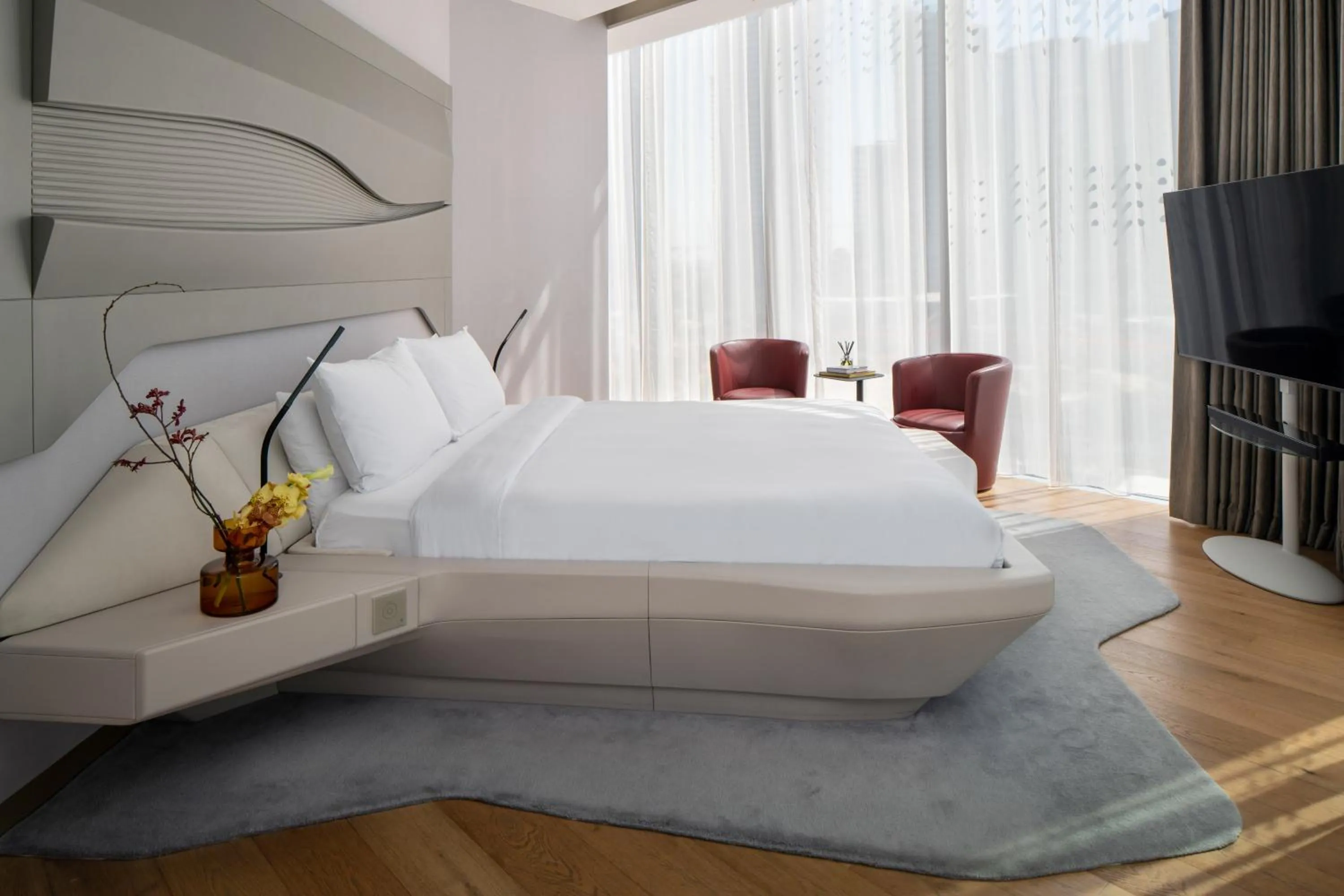 Communal lounge/ TV room, Bed in ME Dubai by Meliá