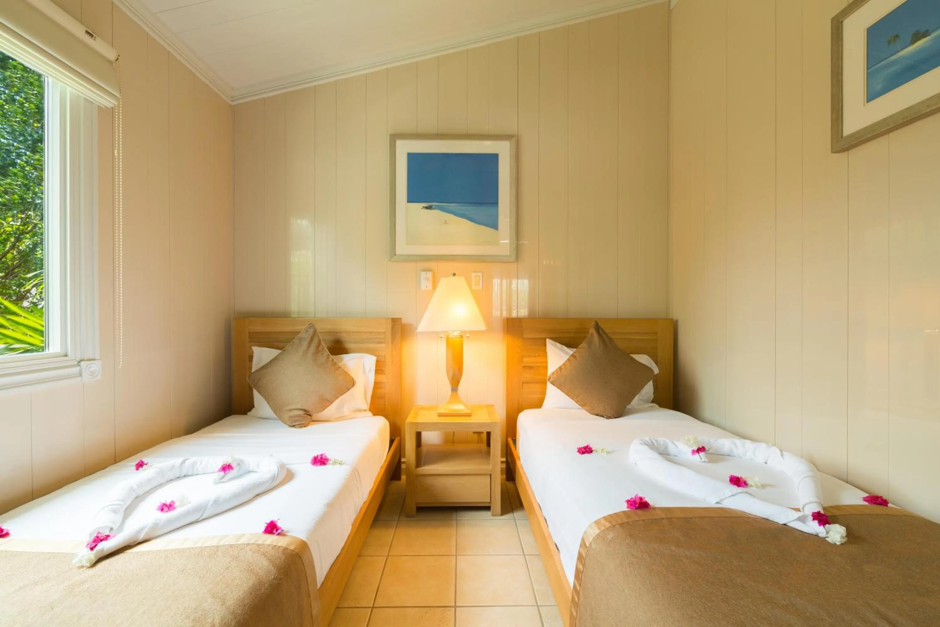 Photo of the whole room, Bed in Kokomo Botanical Resort - Caribbean Family Cottages