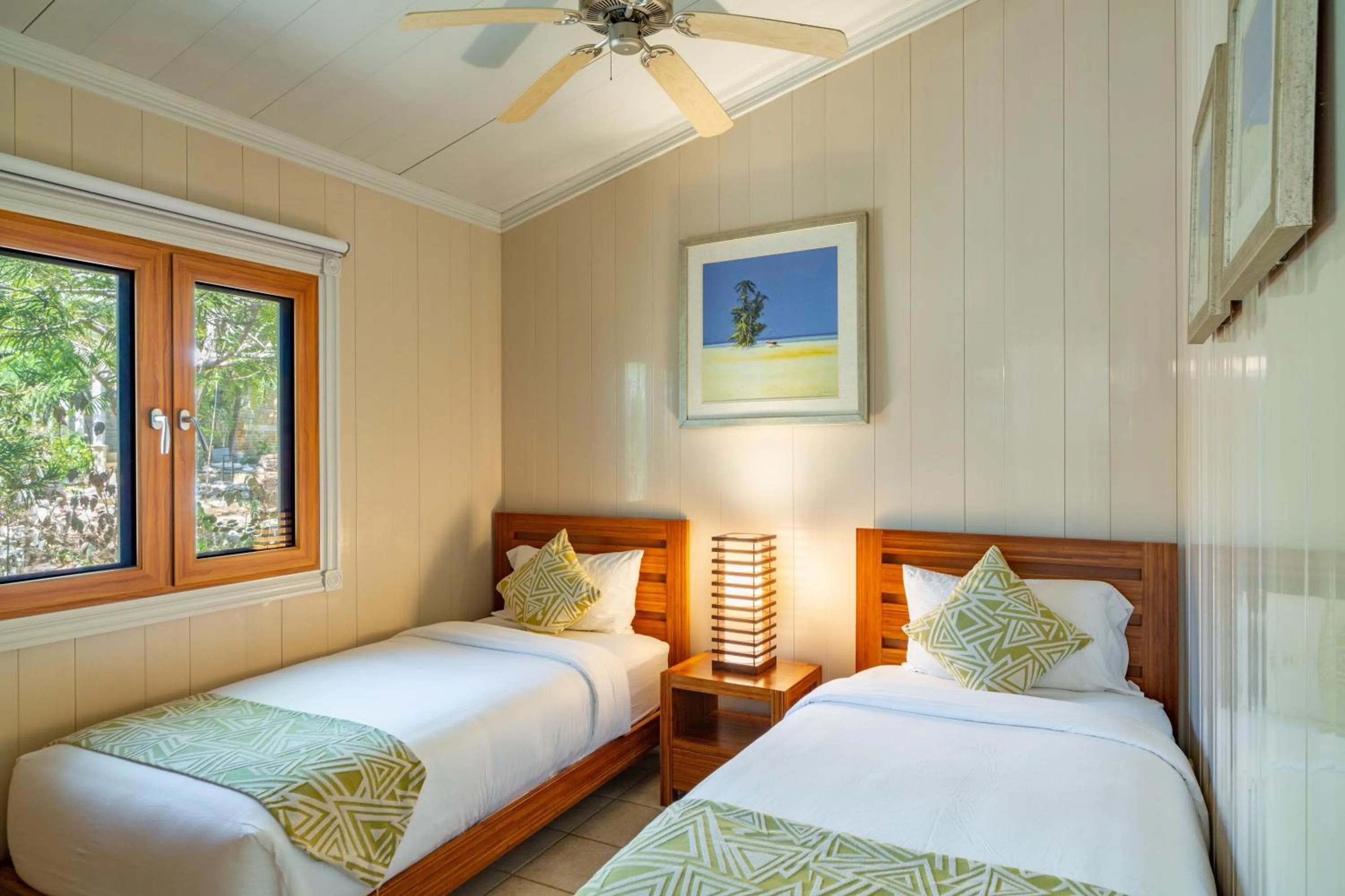 Photo of the whole room, Bed in Kokomo Botanical Resort - Caribbean Family Cottages