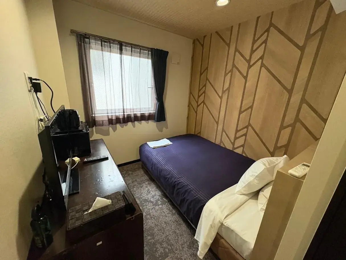 Bed in HOTEL LiVEMAX Himeji Ekimae Bed in HOTEL LiVEMAX Himeji Ekimae