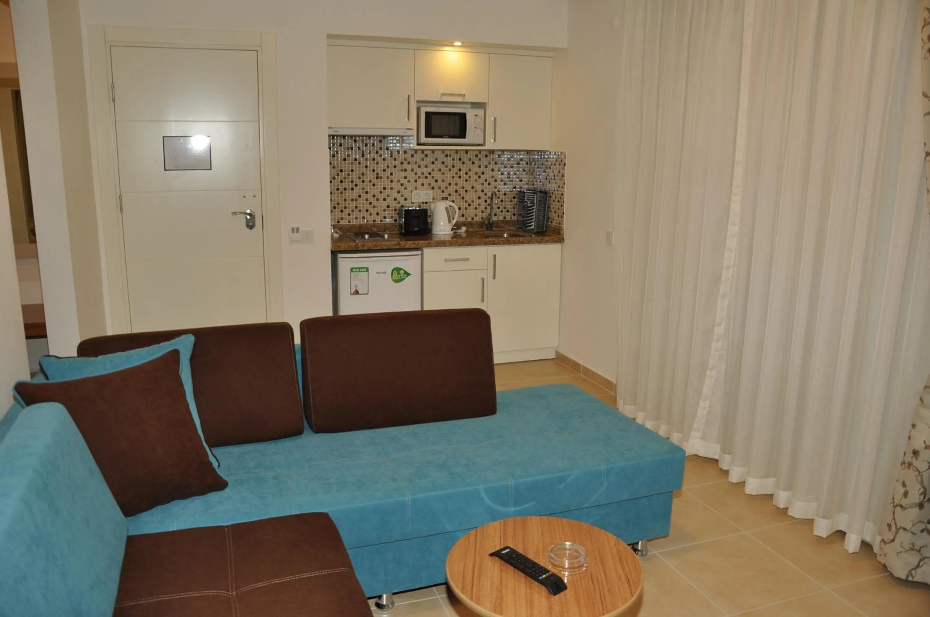 Kitchen or kitchenette in Almera Park Apart Hotel