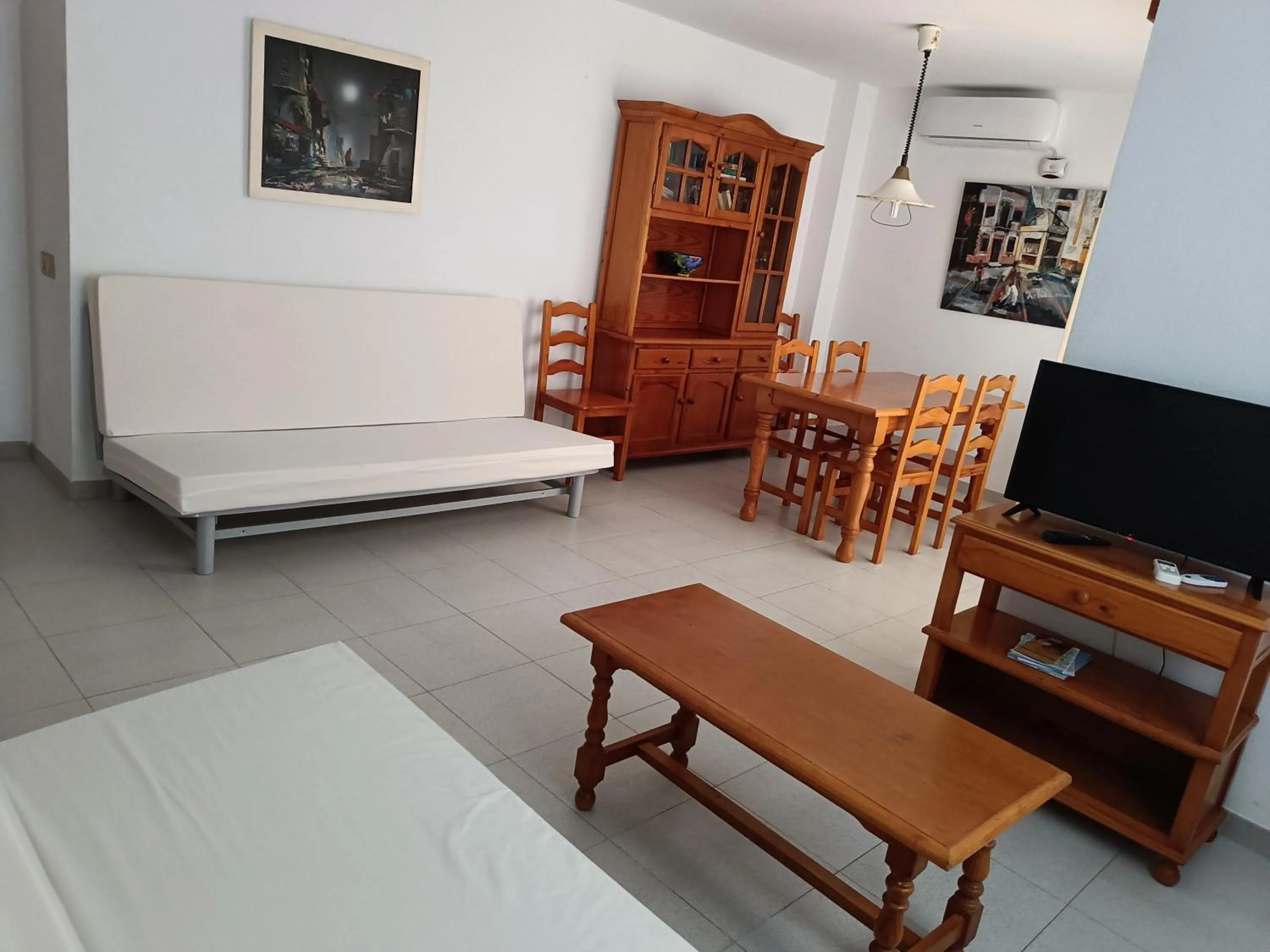 Living room, Bed in Apartamentos Mary