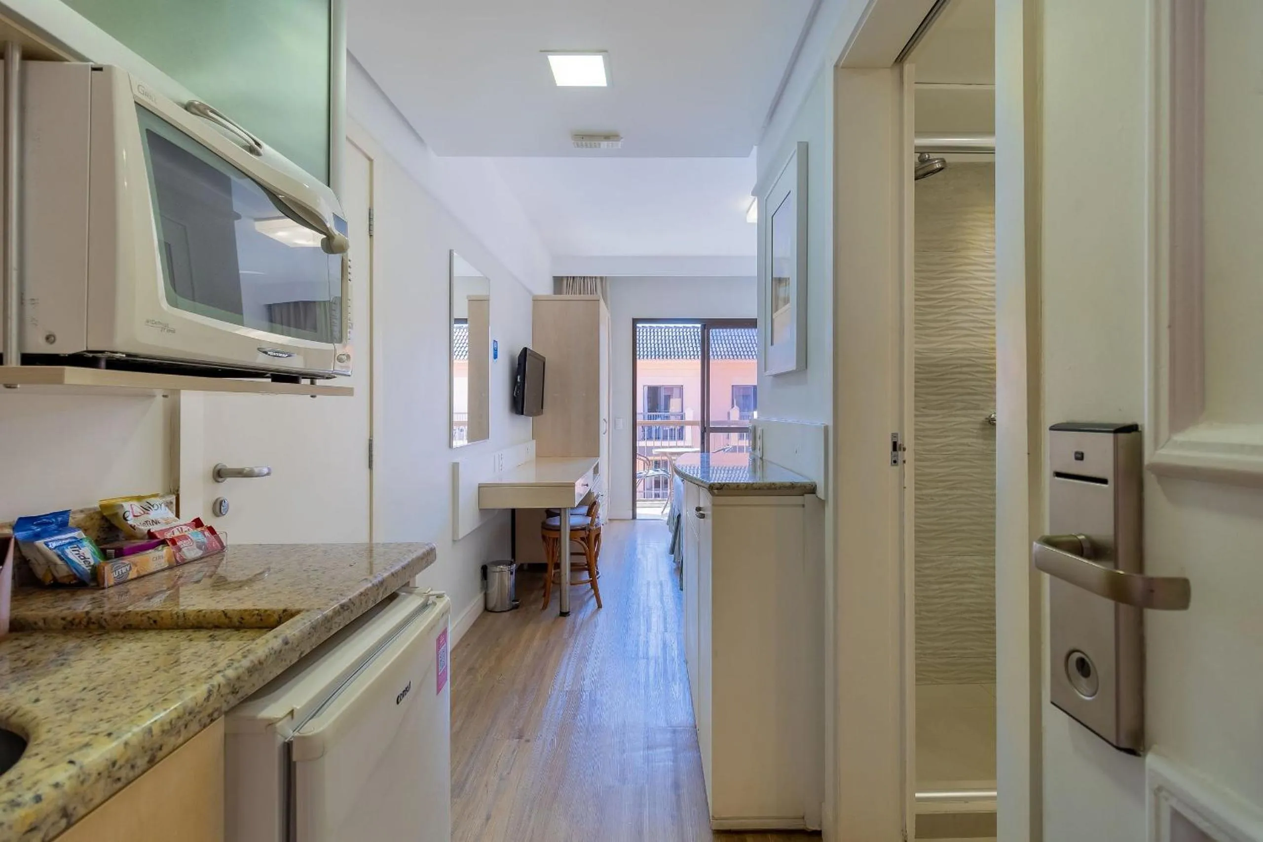 Kitchen or kitchenette in Estúdios Modernos em Resort pé na areia - Jurerê Beach Village JBVJR