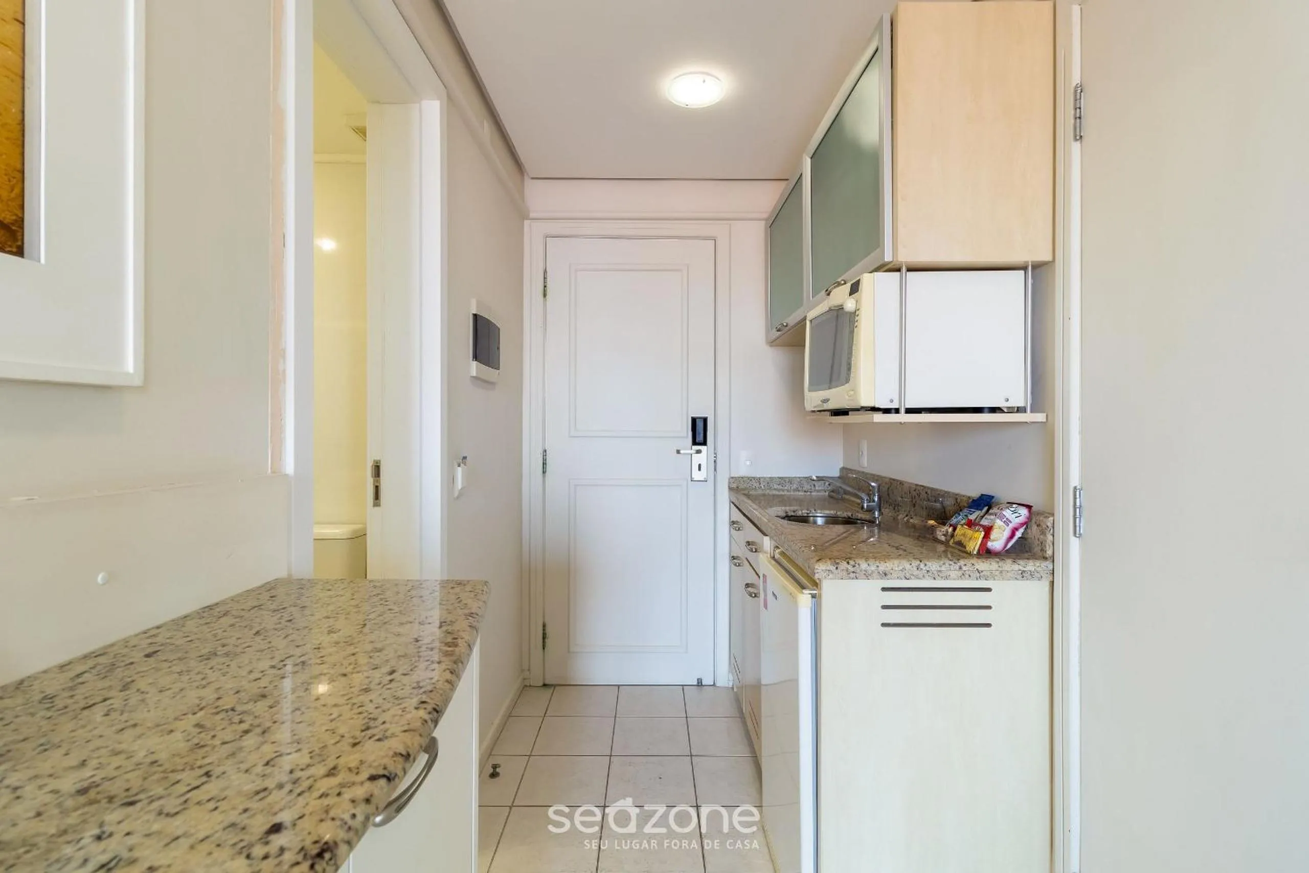 Kitchen or kitchenette in Estúdios Modernos em Resort pé na areia - Jurerê Beach Village JBVJR