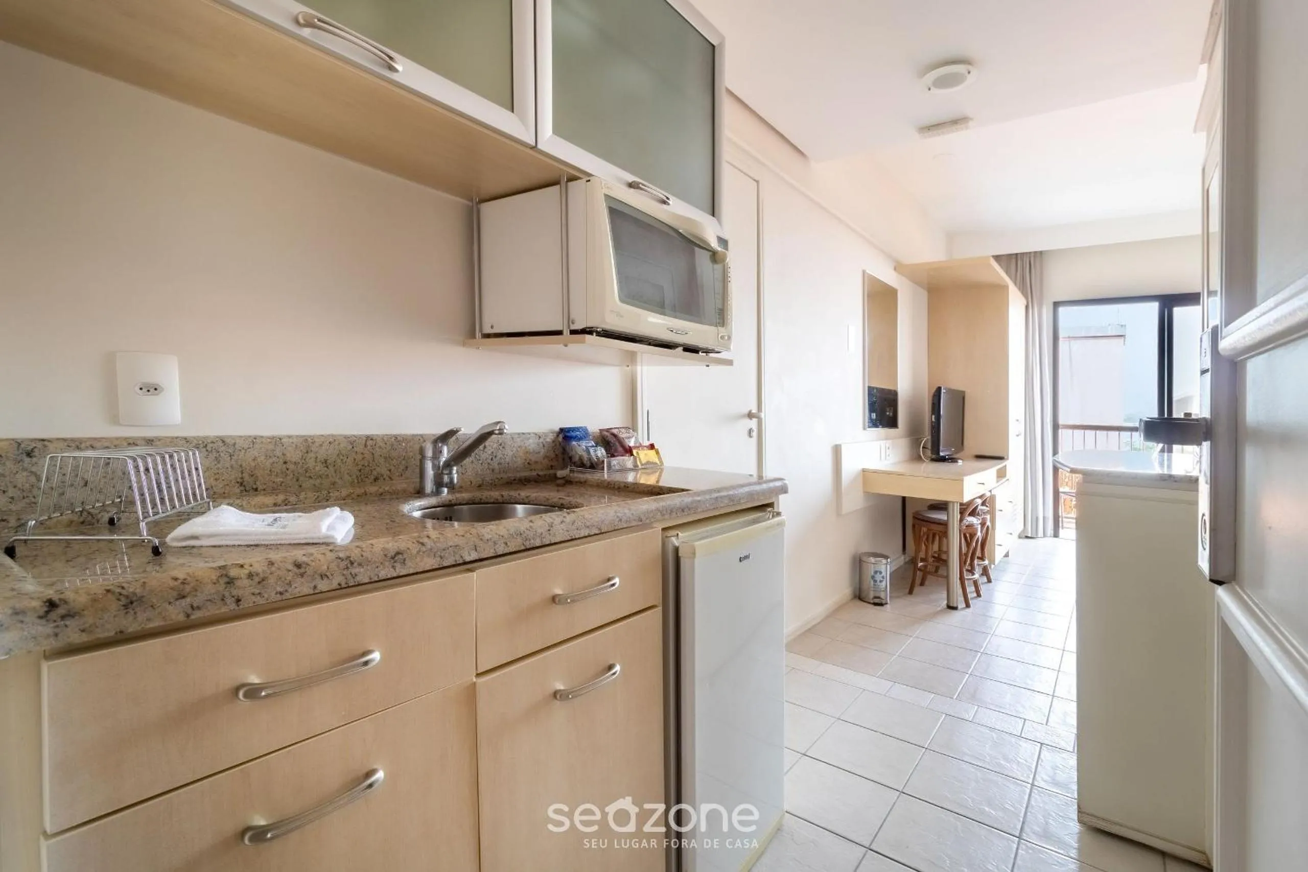 Kitchen or kitchenette in Estúdios Modernos em Resort pé na areia - Jurerê Beach Village JBVJR
