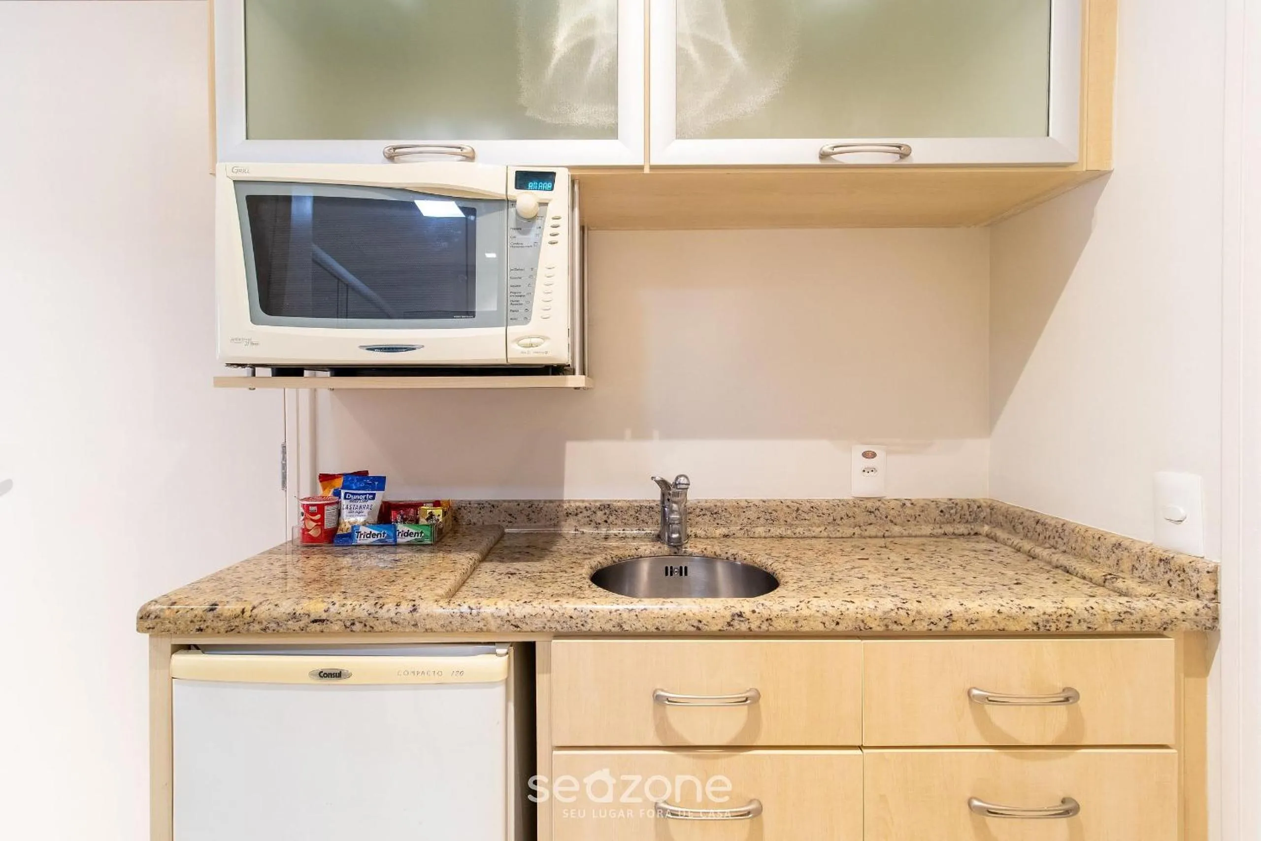 Kitchen or kitchenette in Estúdios Modernos em Resort pé na areia - Jurerê Beach Village JBVJR