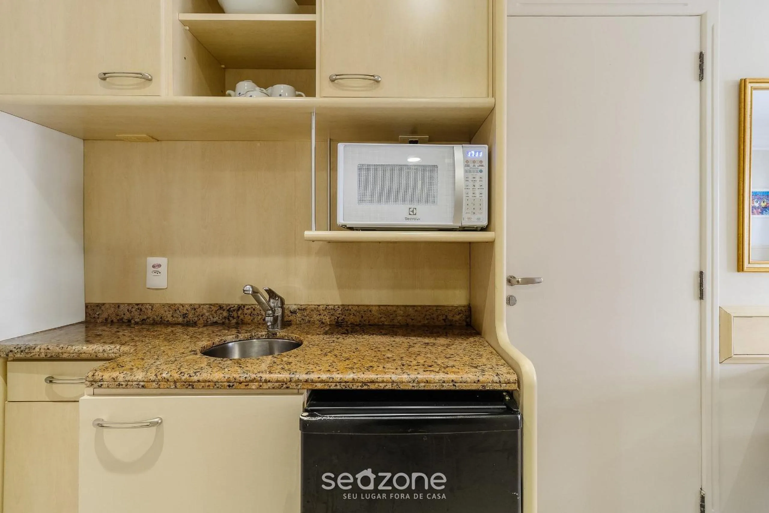 Kitchen or kitchenette in Estúdios Modernos em Resort pé na areia - Jurerê Beach Village JBVJR
