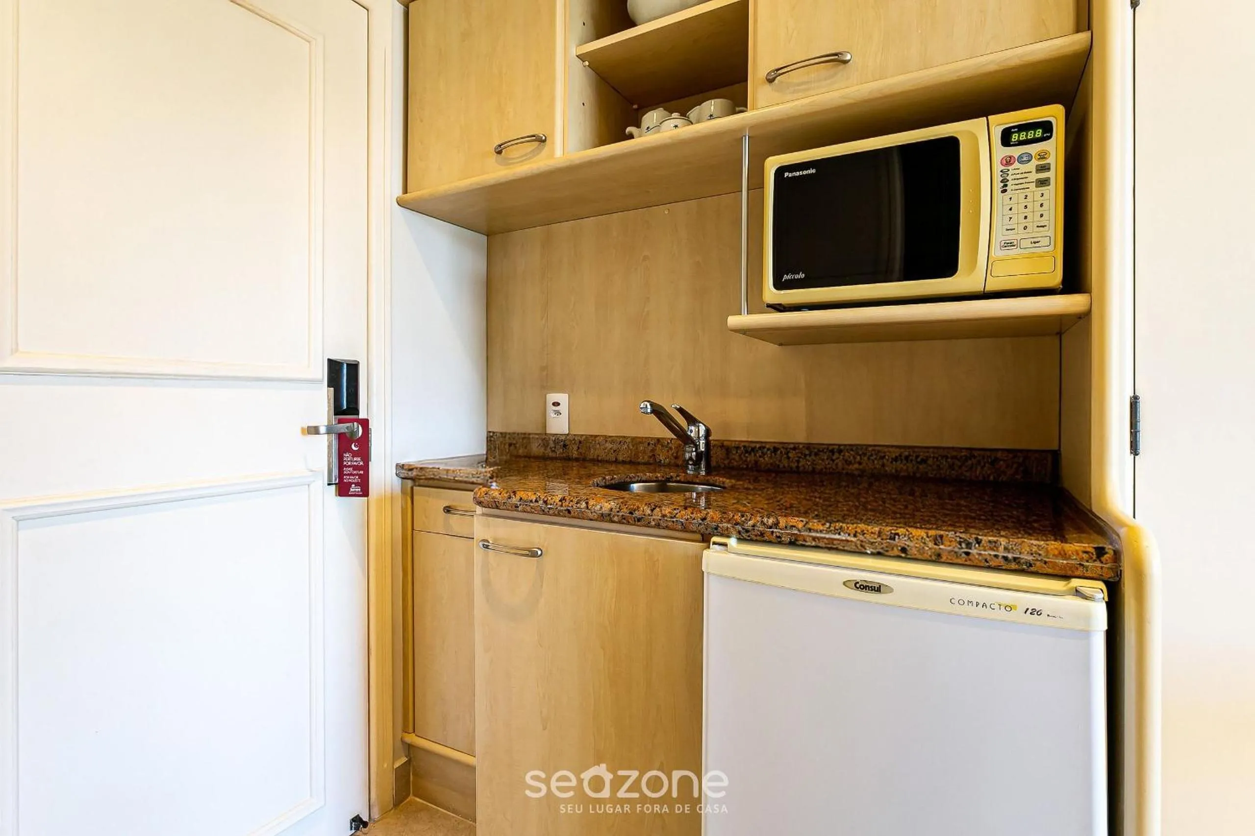 Kitchen or kitchenette in Estúdios Modernos em Resort pé na areia - Jurerê Beach Village JBVJR