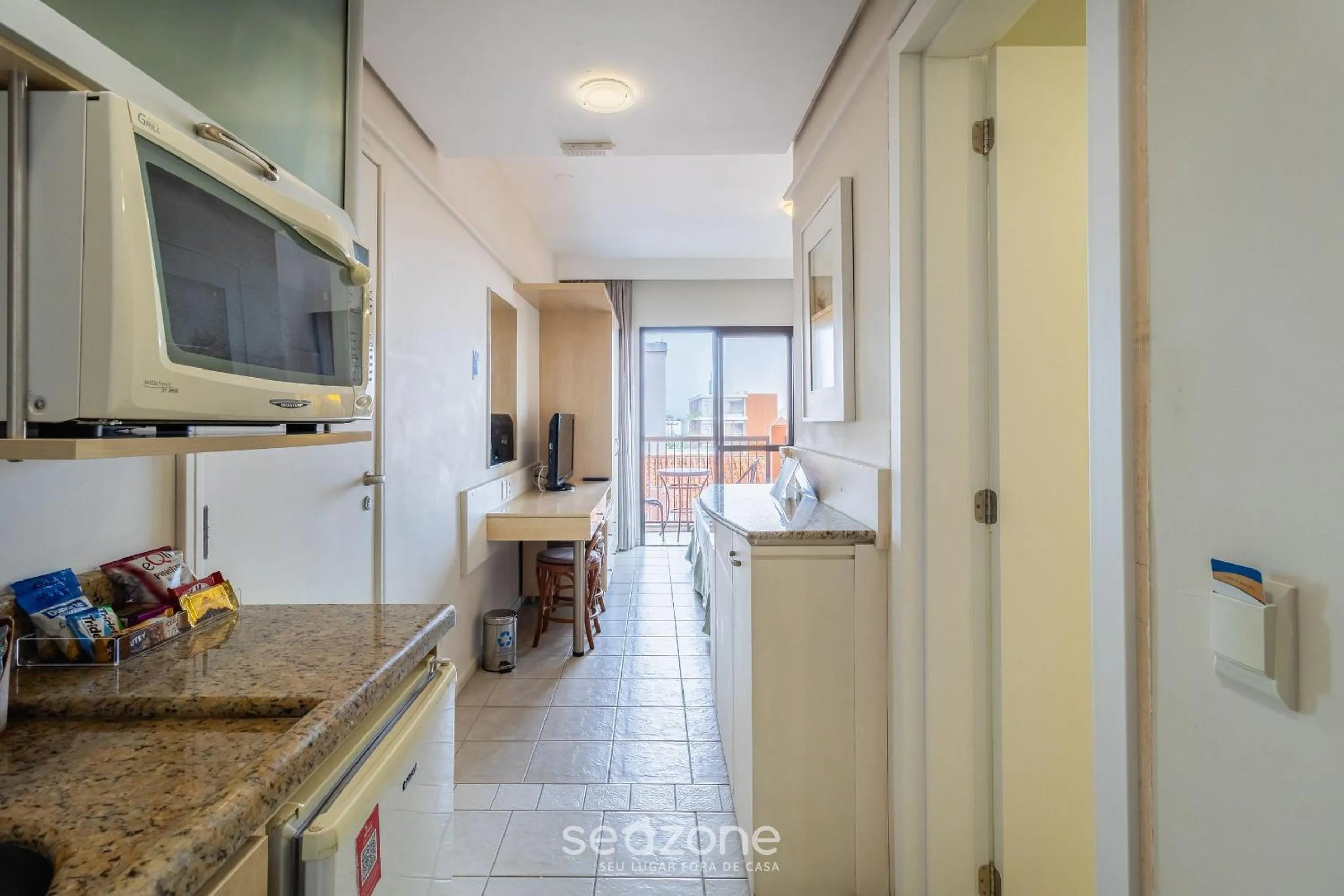 Kitchen or kitchenette in Estúdios Modernos em Resort pé na areia - Jurerê Beach Village JBVJR