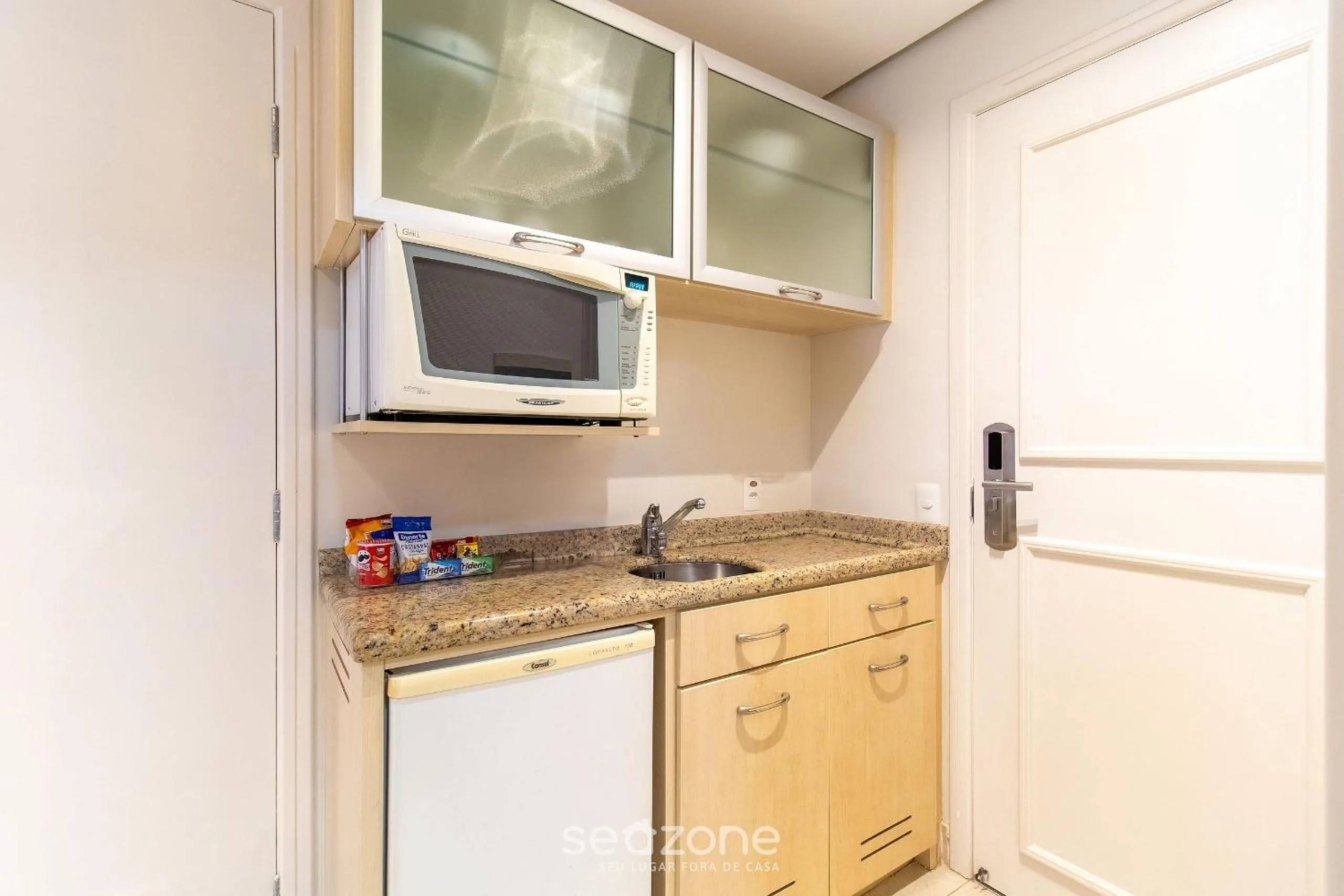 Kitchen or kitchenette in Estúdios Modernos em Resort pé na areia - Jurerê Beach Village JBVJR