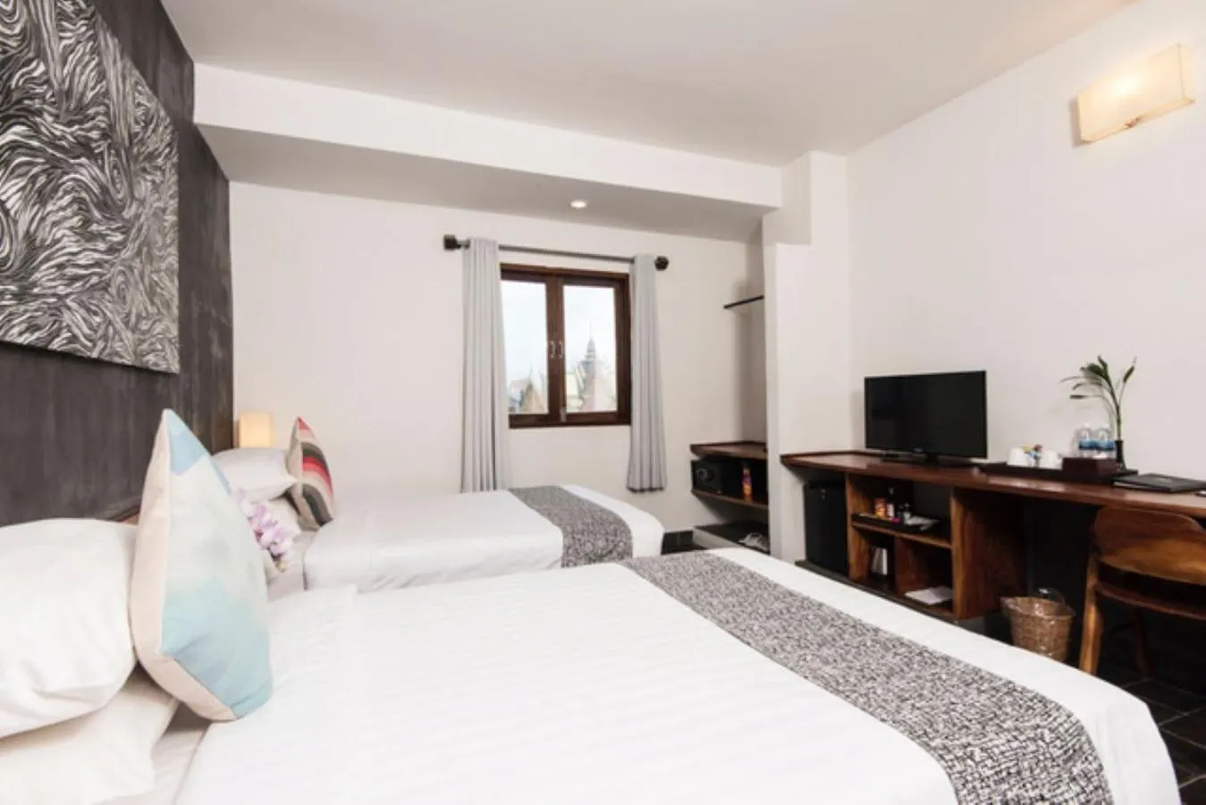 Bed in PATIO Hotel & Urban Resort