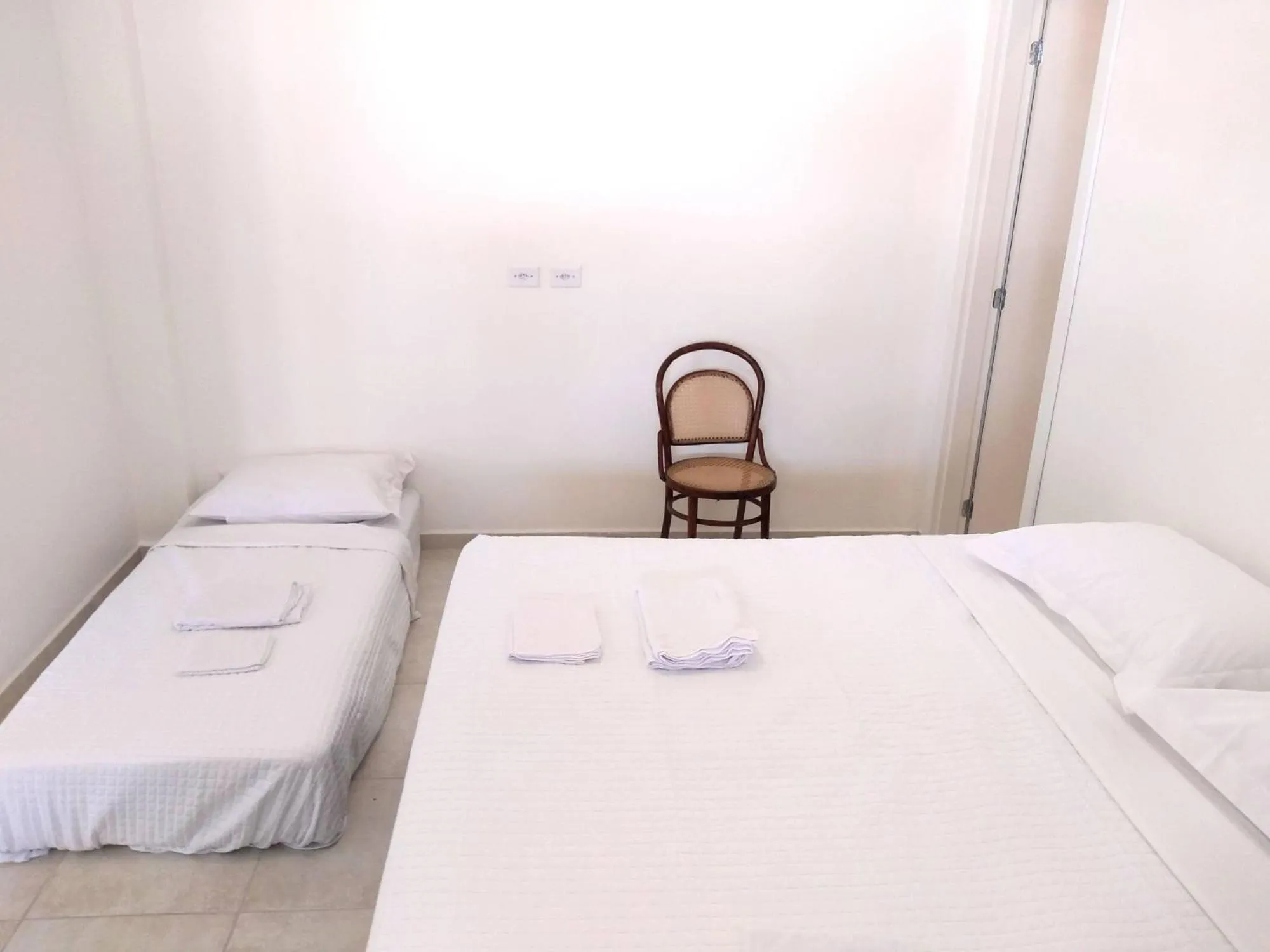 Bed in Pousada Pontal do Sul