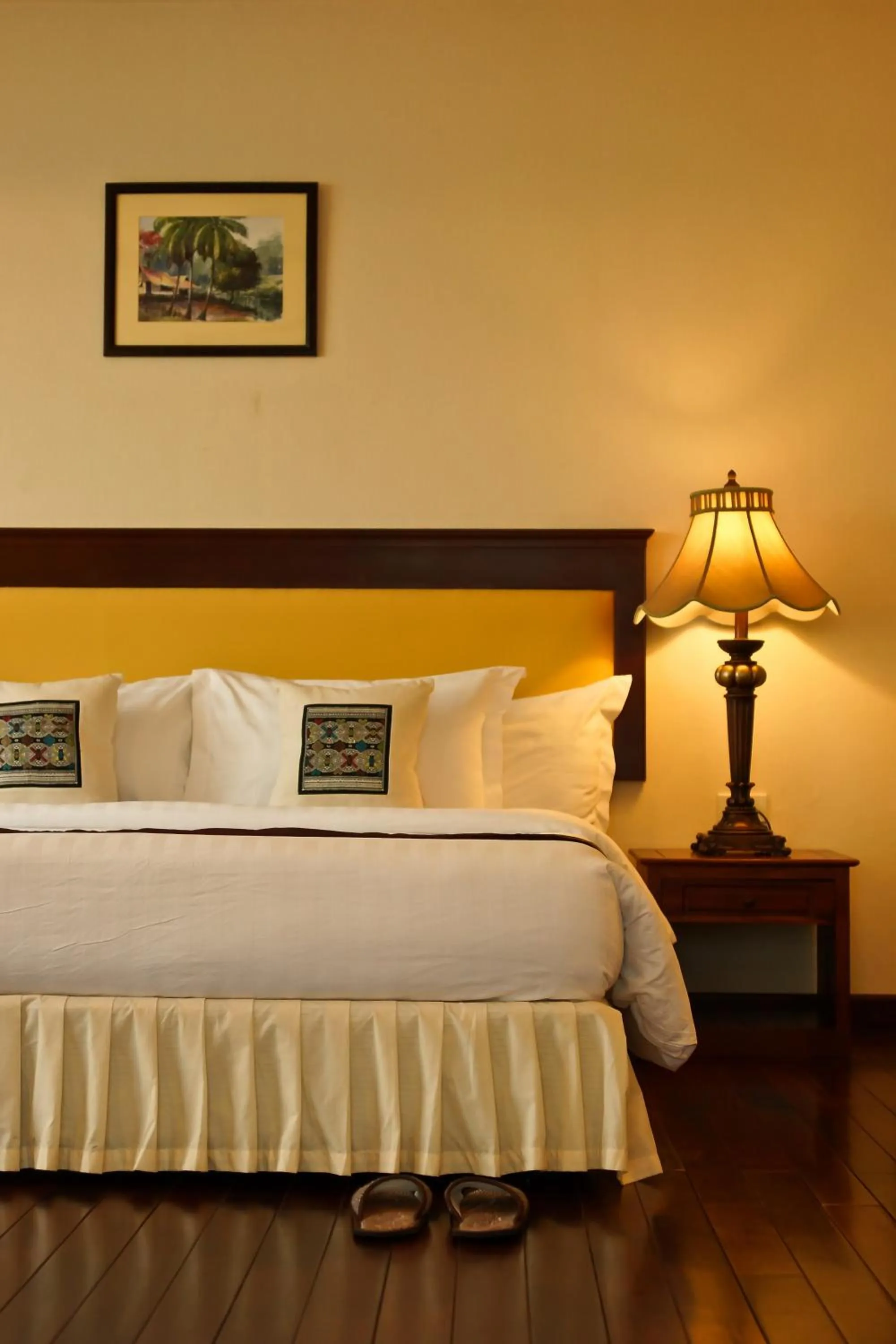 Living room, Bed in Champasak Grand Hotel