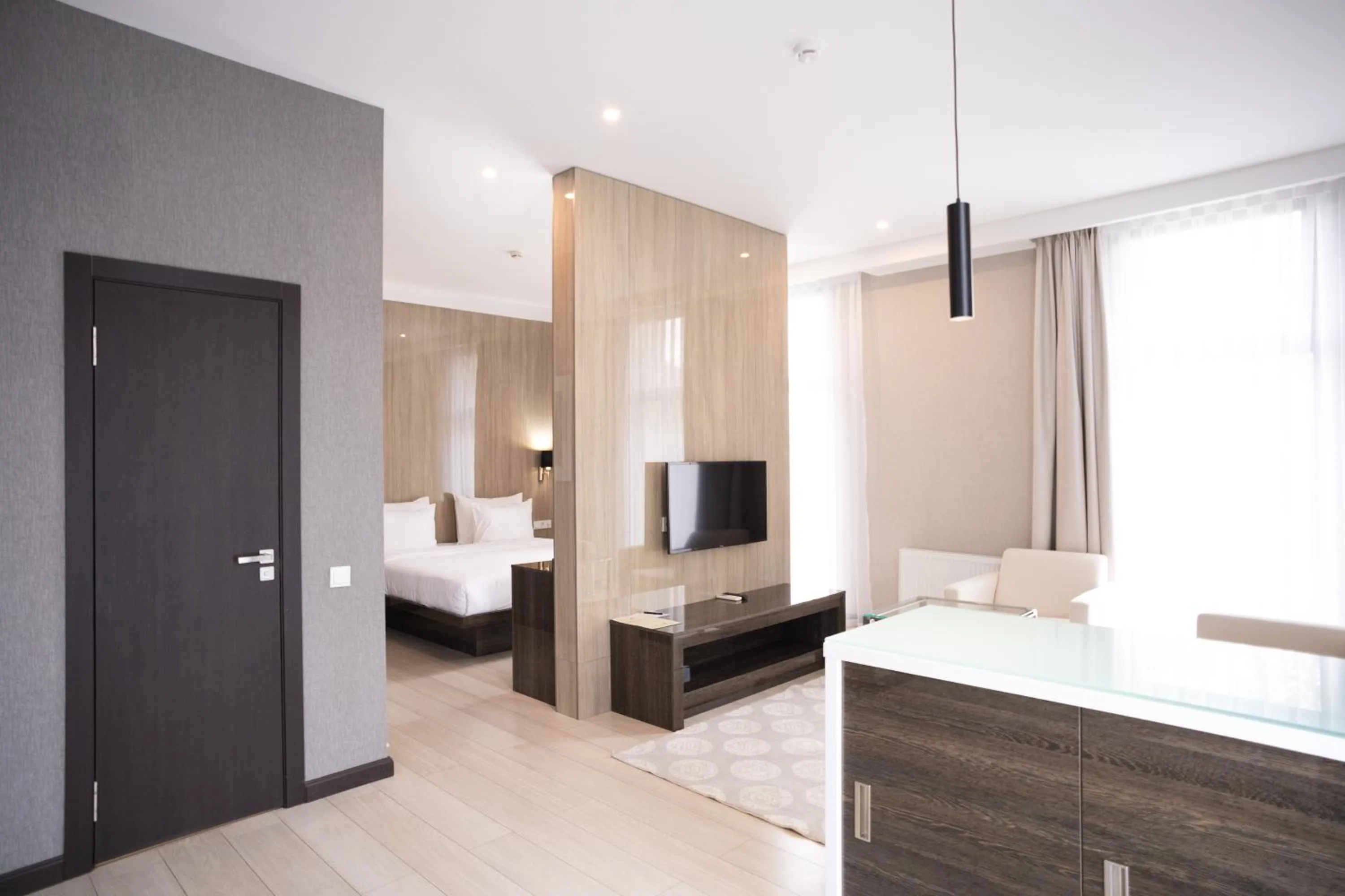 Living room, Bed in Resident City Hotel