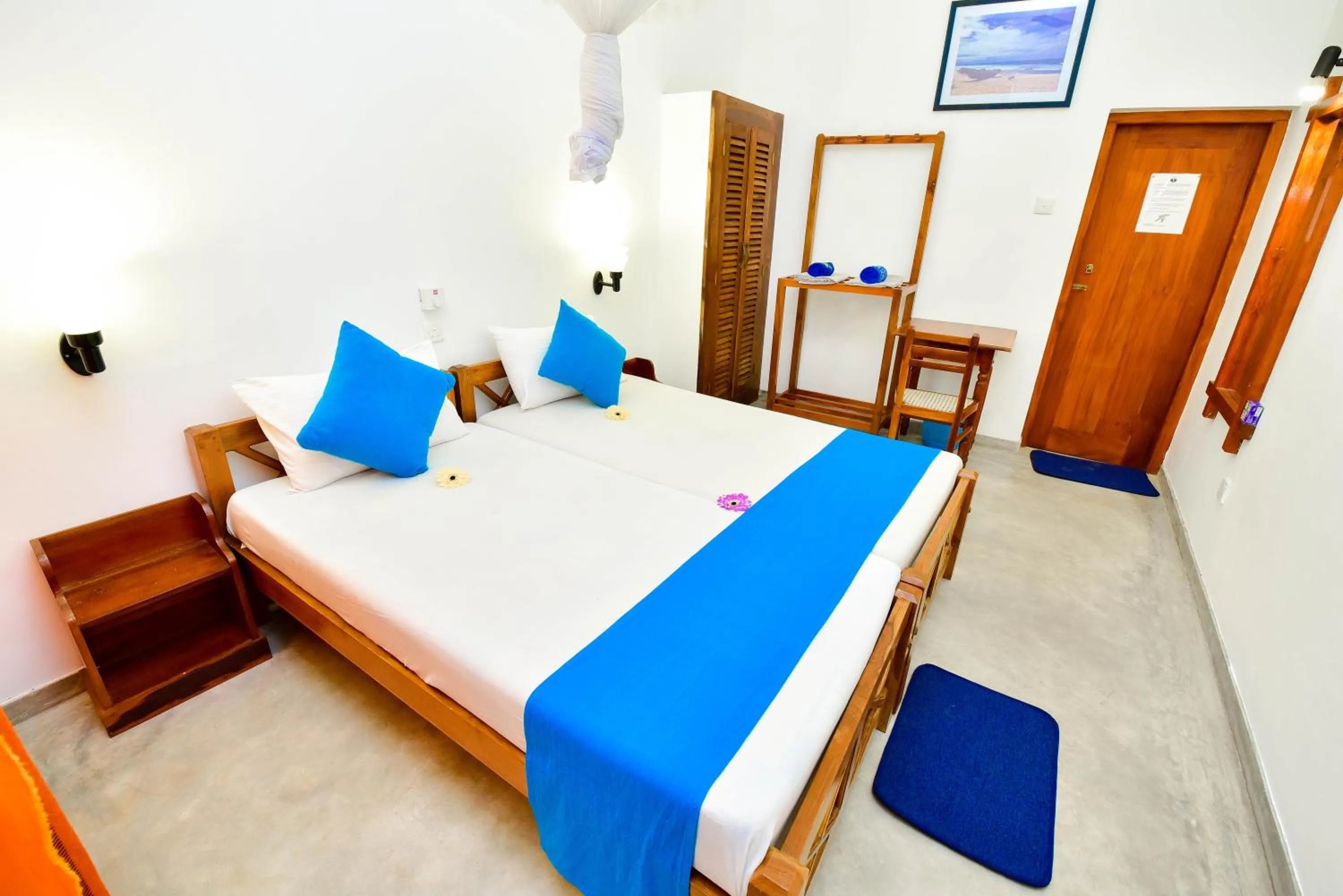 Bed in International Beach Hotel & Restaurant
