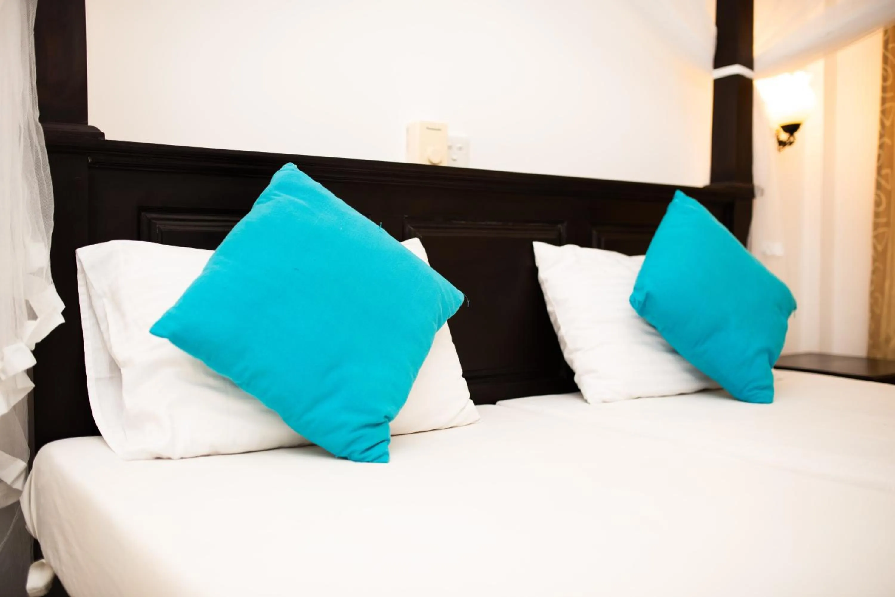 Bed in International Beach Hotel & Restaurant