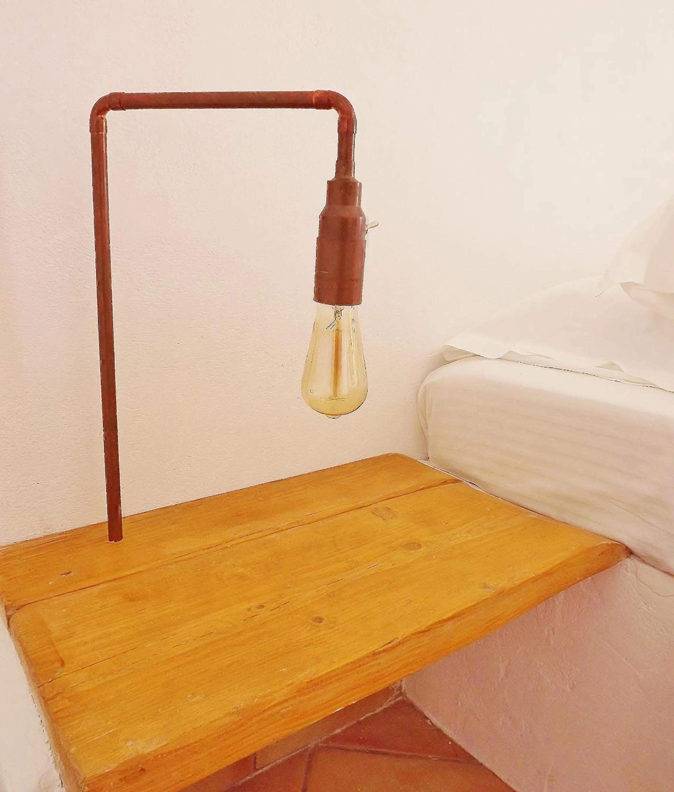 Bed in Votsalo Apartments