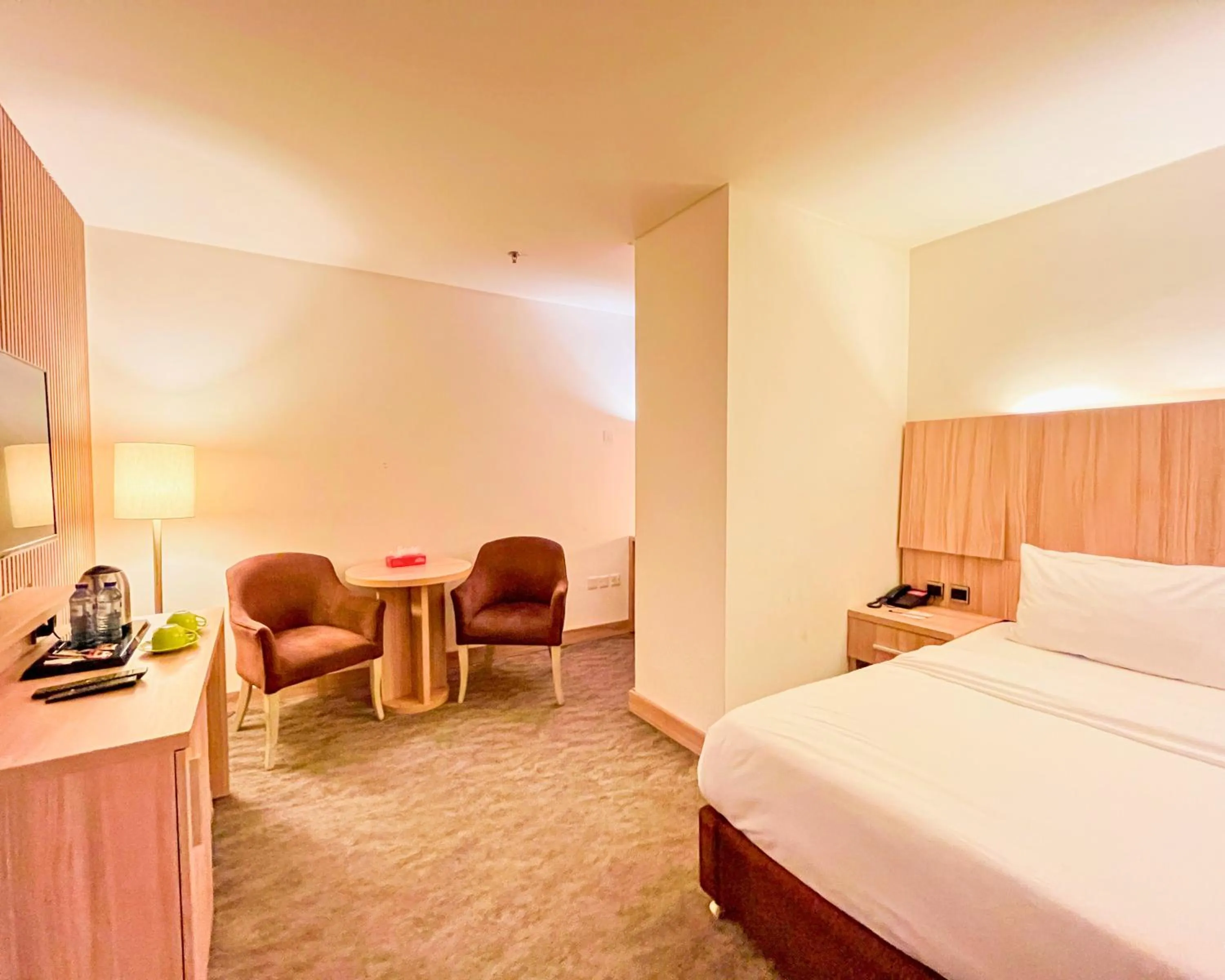 Seating area, Bed in La Casa Hotel Amman by FHM