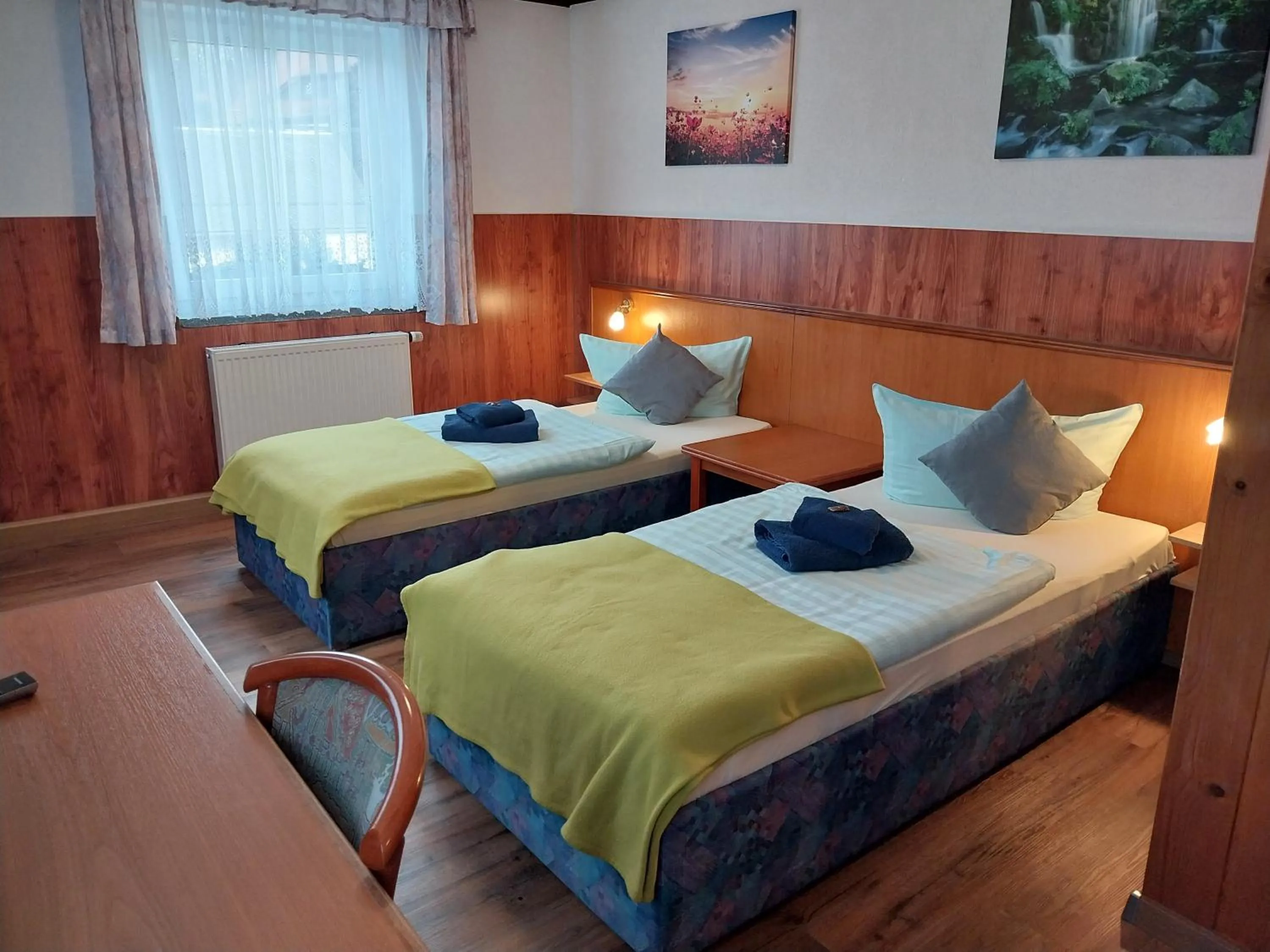 Photo of the whole room, Bed in Landhotel Waldschlößchen mit Gaststube