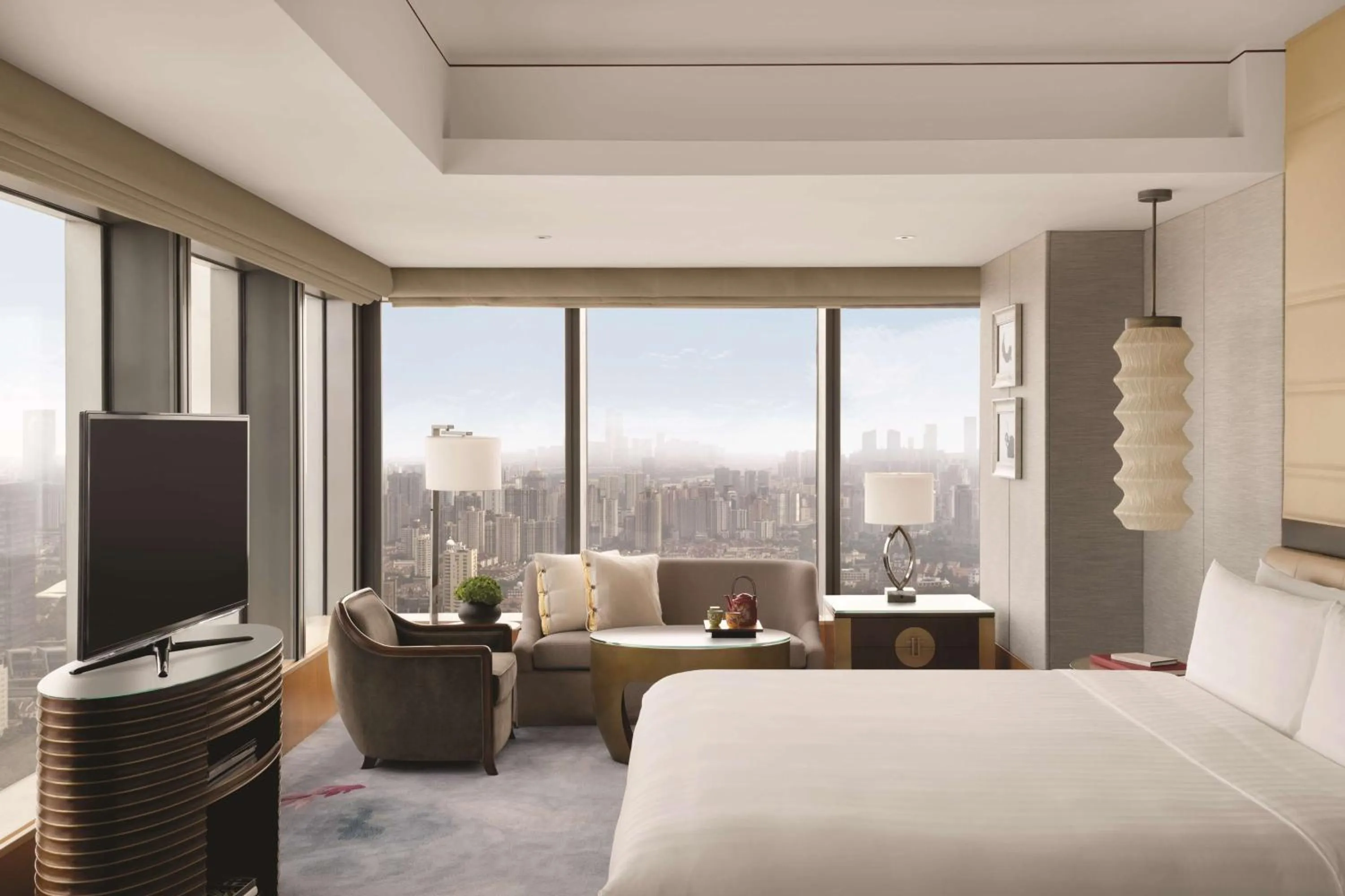 Photo of the whole room, Bed in Jing An Shangri-La, Shanghai - sits centrally amid Puxi's iconic landmarks, uniquely positioned nearby Jing'an Temple