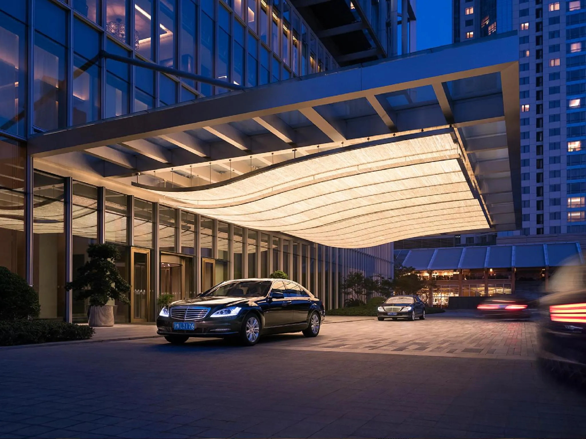 Facade/entrance in Jing An Shangri-La, Shanghai - sits centrally amid Puxi's iconic landmarks, uniquely positioned nearby Jing'an Temple
