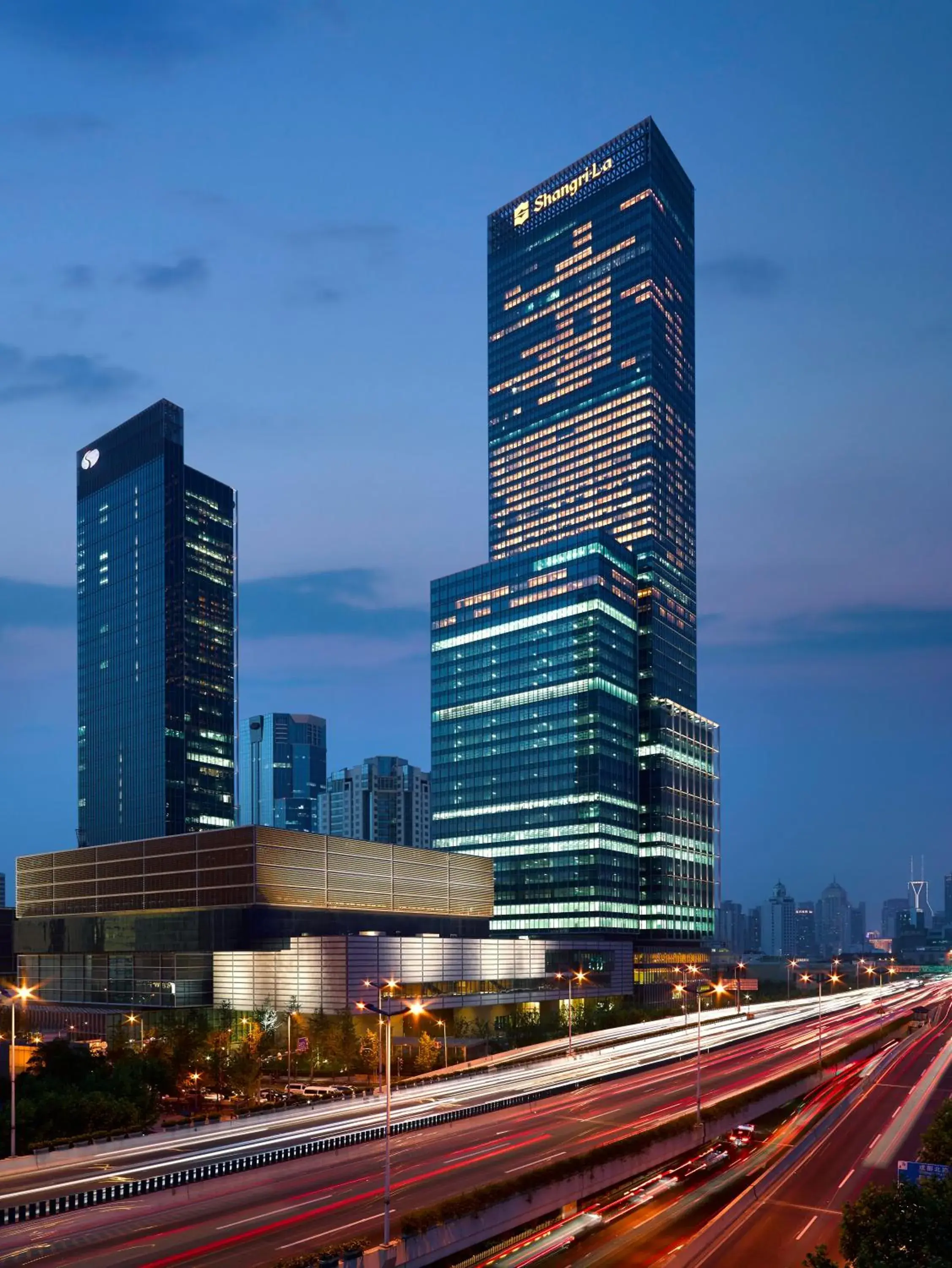 Facade/entrance in Jing An Shangri-La, Shanghai - sits centrally amid Puxi's iconic landmarks, uniquely positioned nearby Jing'an Temple Facade/entrance in Jing An Shangri-La, Shanghai - sits centrally amid Puxi's iconic landmarks, uniquely positioned nearby Jing'an Temple